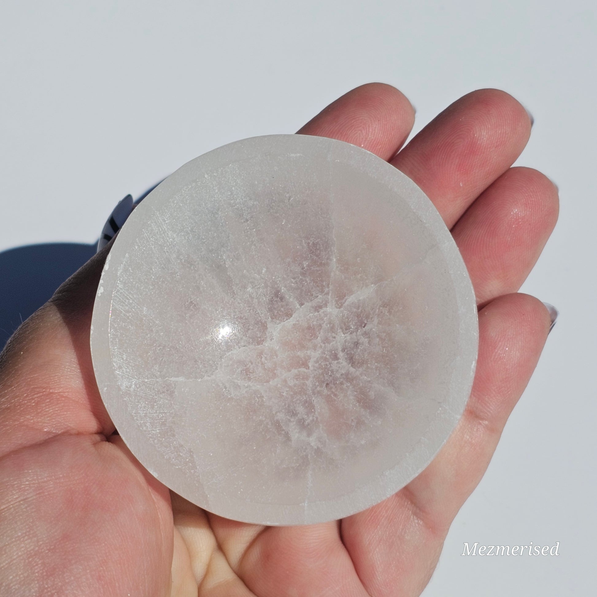 A small Selenite round dish perfect for cleansing your mini crystals.