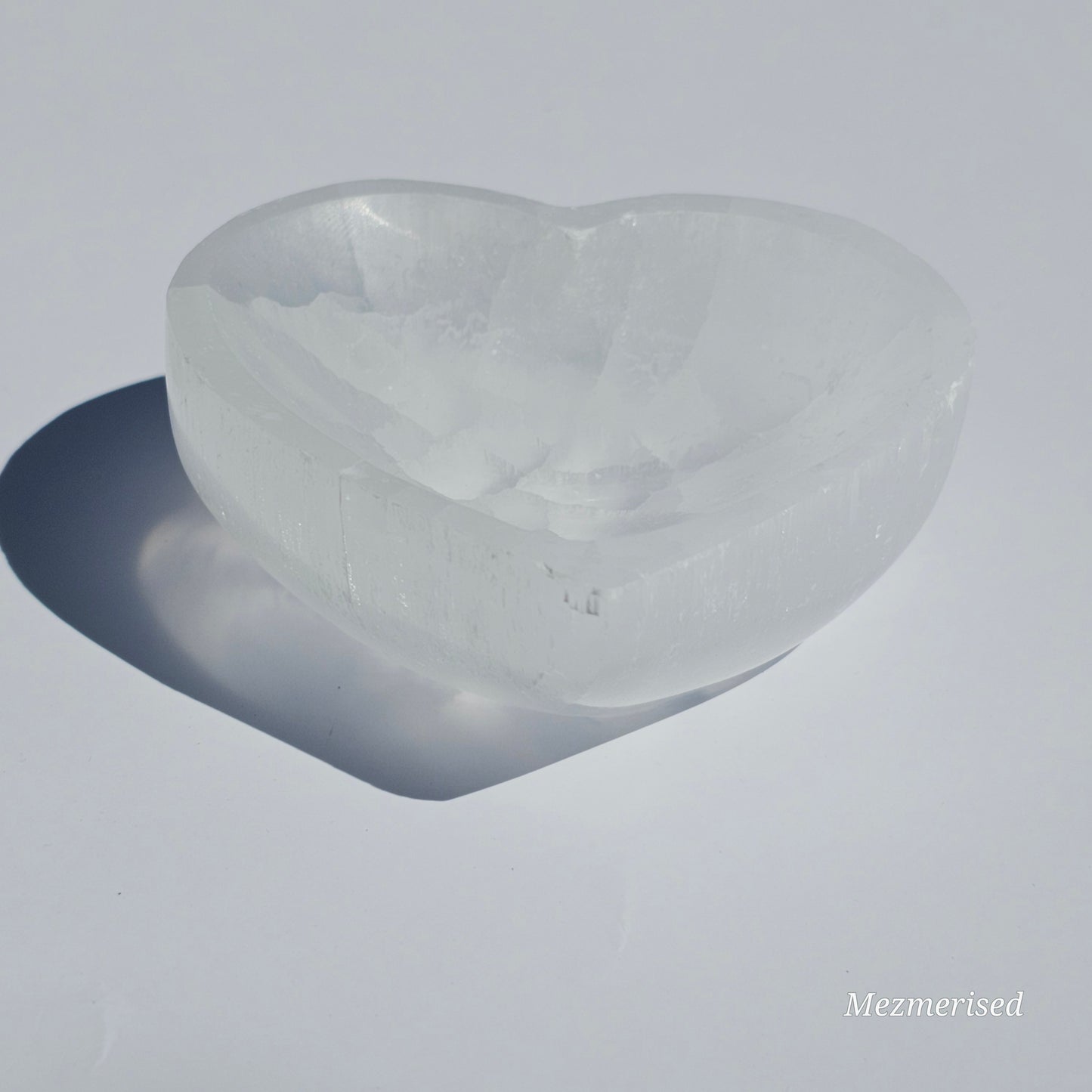 A small Selenite heart dish perfect for cleansing your mini crystals.