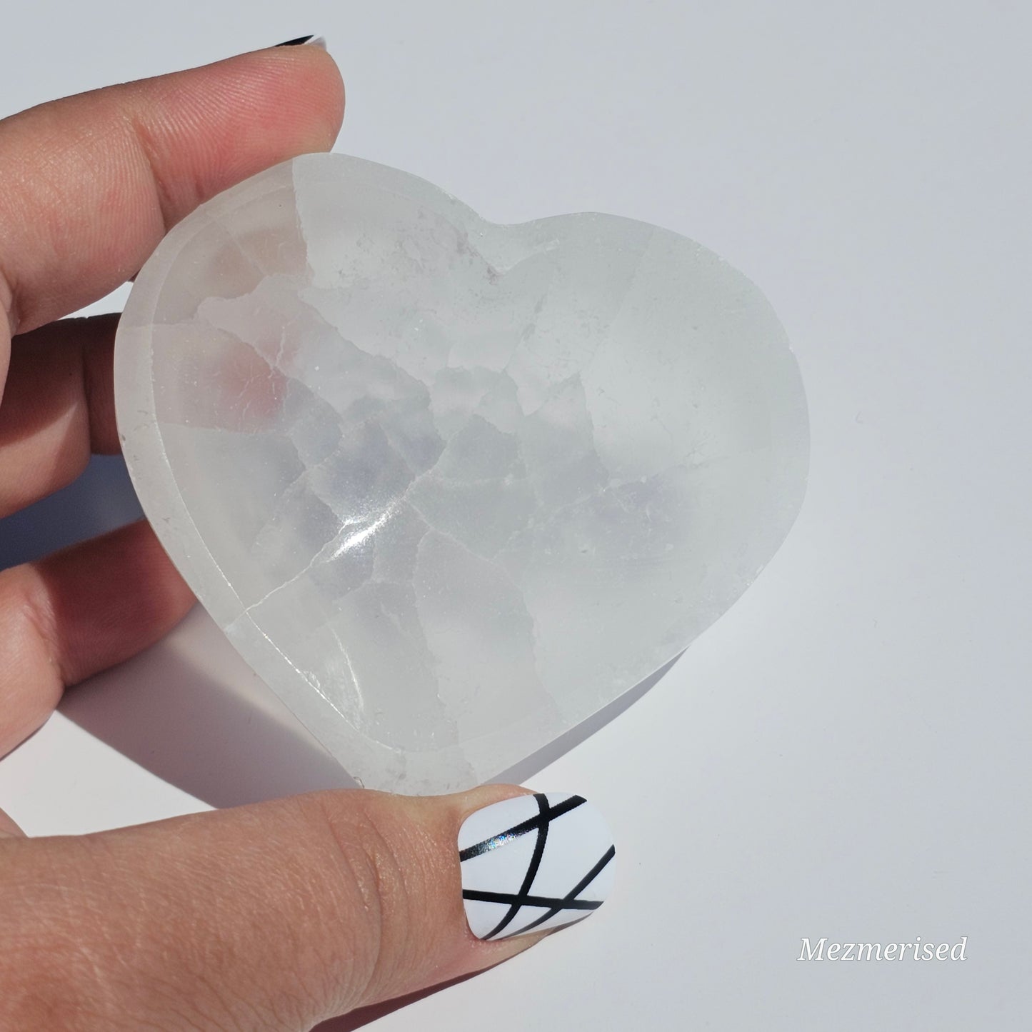 A small Selenite heart dish perfect for cleansing your mini crystals.