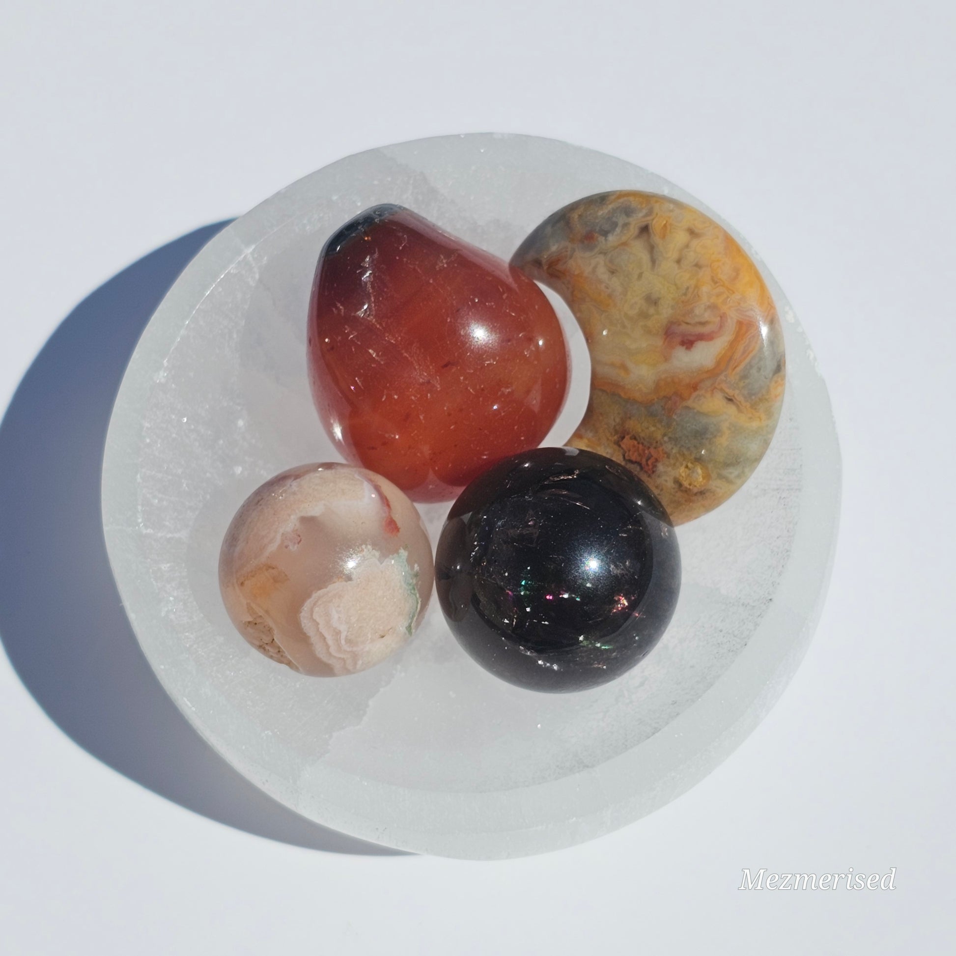 A small Selenite round dish perfect for cleansing your mini crystals.