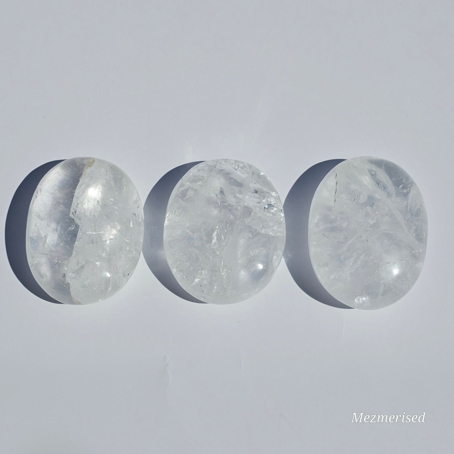 Stunning transparent Clear Quartz palm stones with rainbows.