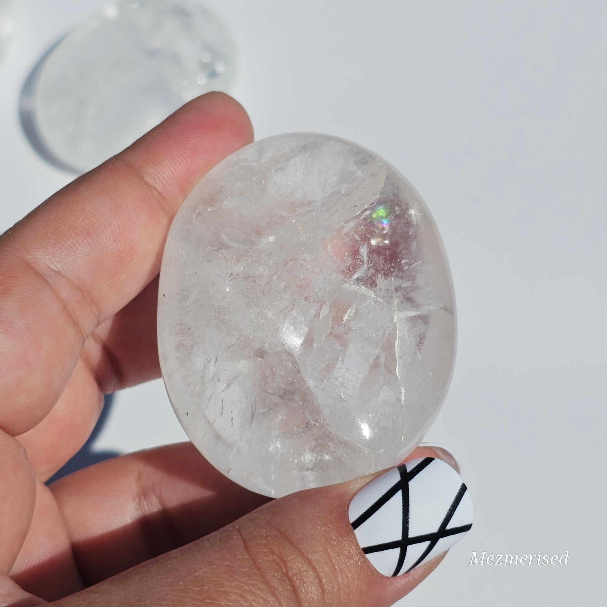 Stunning transparent Clear Quartz palm stones with rainbows.