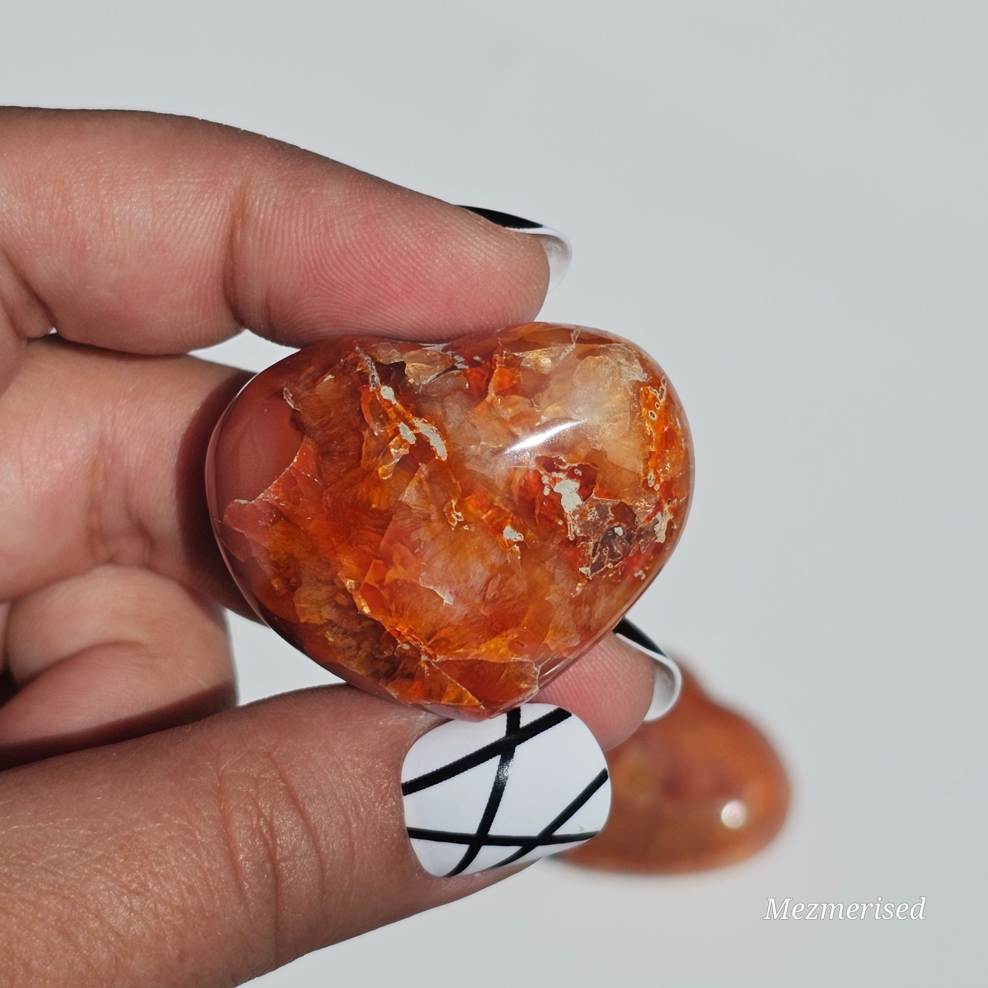 Small beautifully carved puffy Carnelian hearts.