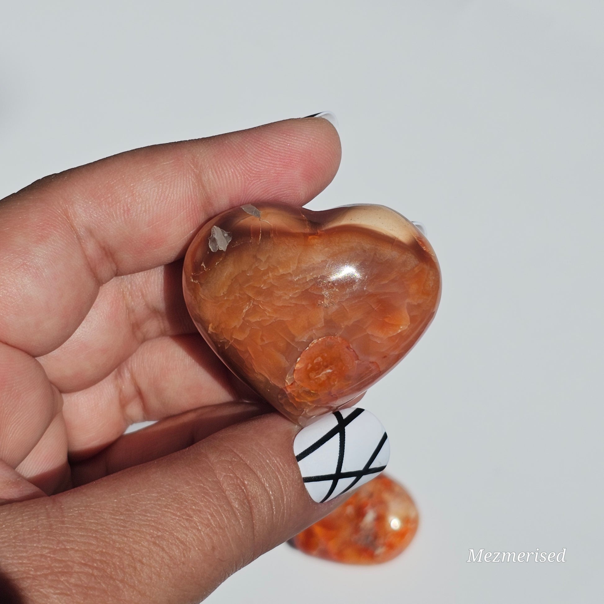 Small beautifully carved puffy Carnelian hearts.