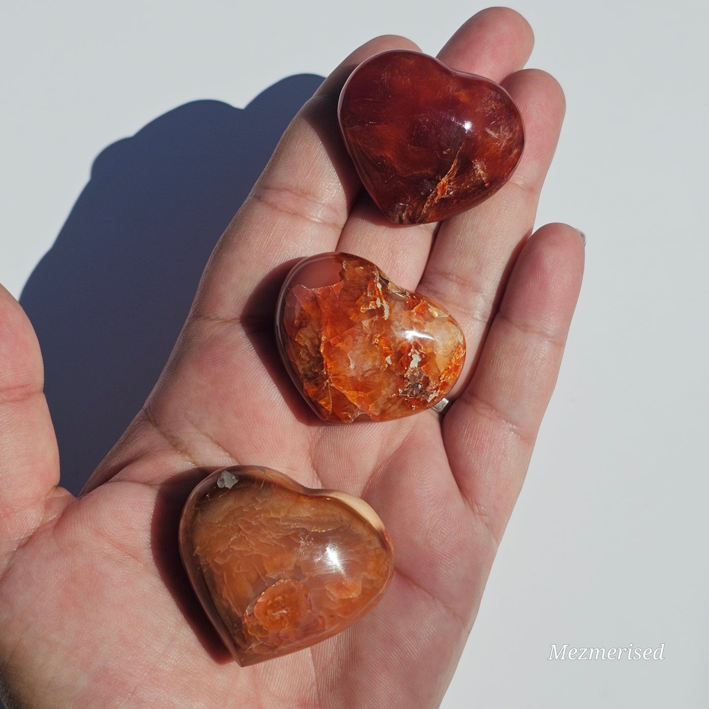 Small beautifully carved puffy Carnelian hearts.