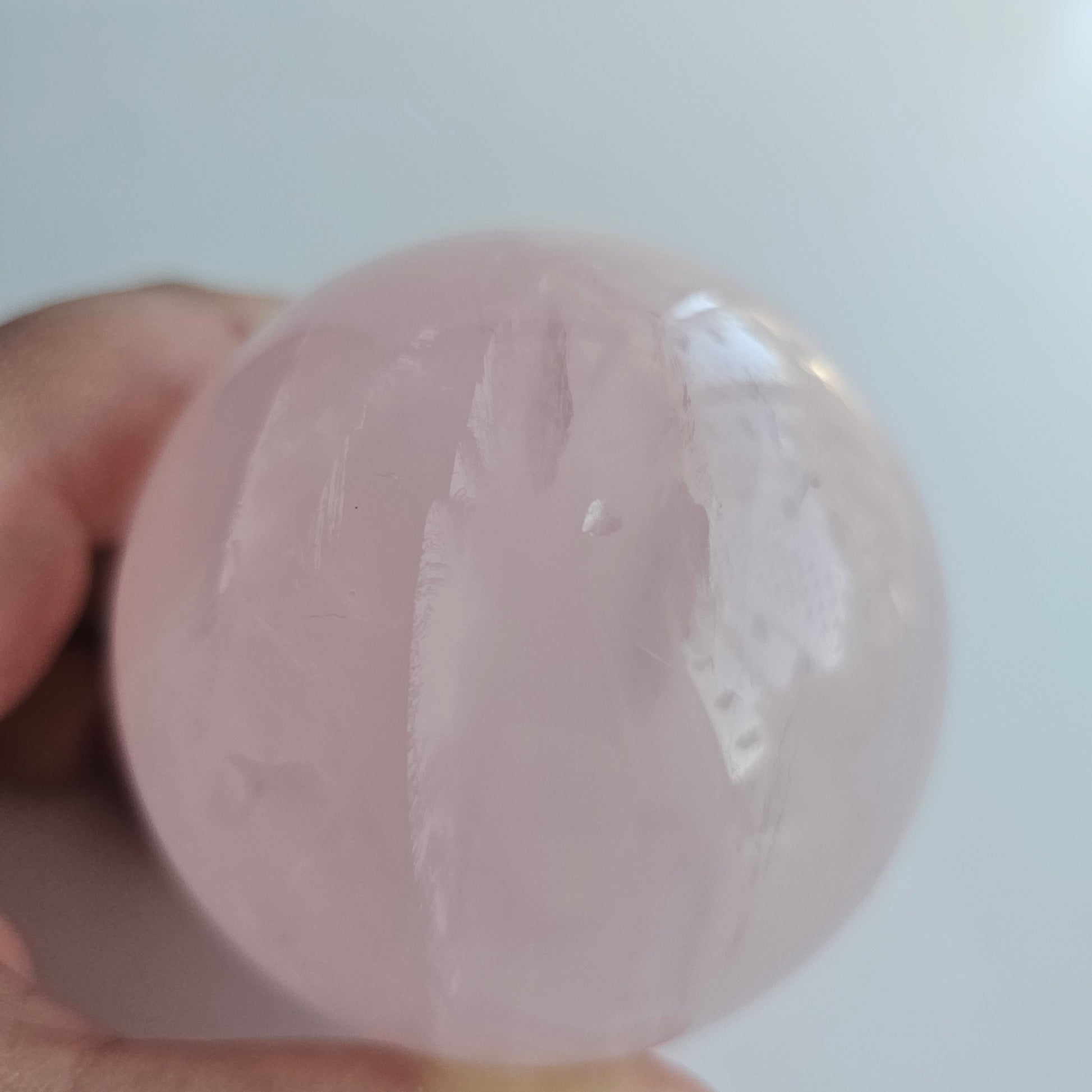 A beautiful Rose Quartz sphere with flash and gorgeous rainbows