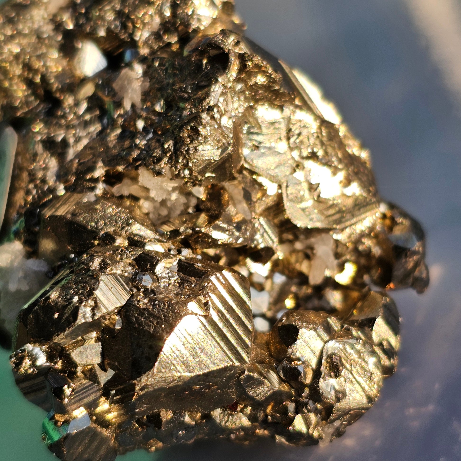 Natural Pyrite cluster in its raw form. This mineral displays a brilliant metallic lustre, with well-defined and sharp parallel striations.