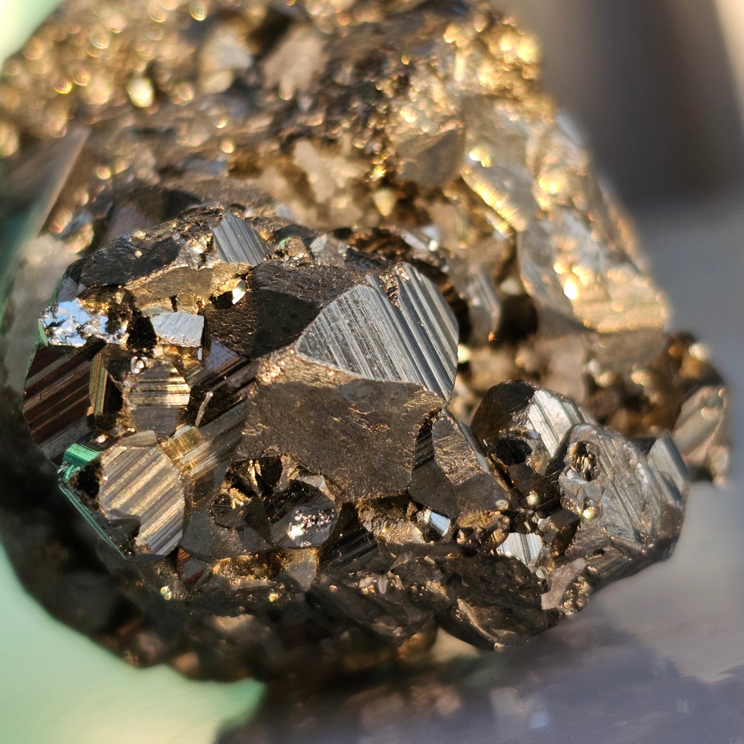 Natural Pyrite cluster in its raw form. This mineral displays a brilliant metallic lustre, with well-defined and sharp parallel striations.