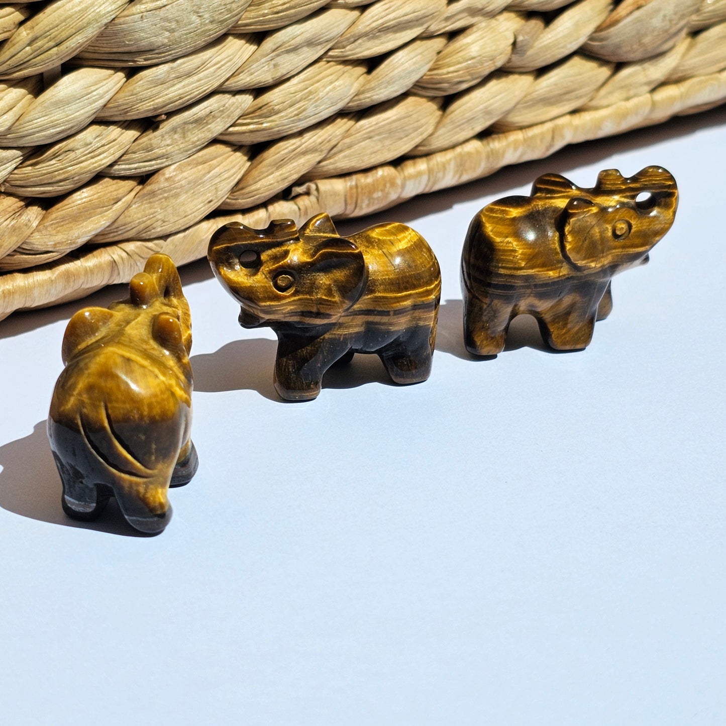 Cute Tiger's Eye elephant carvings