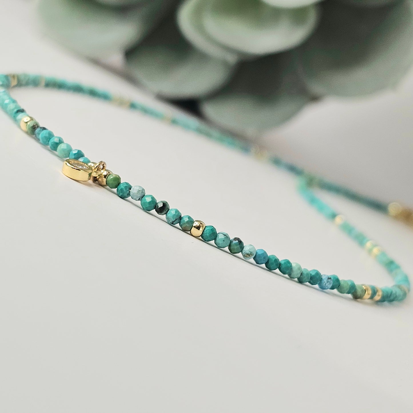 Close-up of the faceted Turquoise beads highlighting their soft blue-green tones, natural texture, and subtle faceted finish.