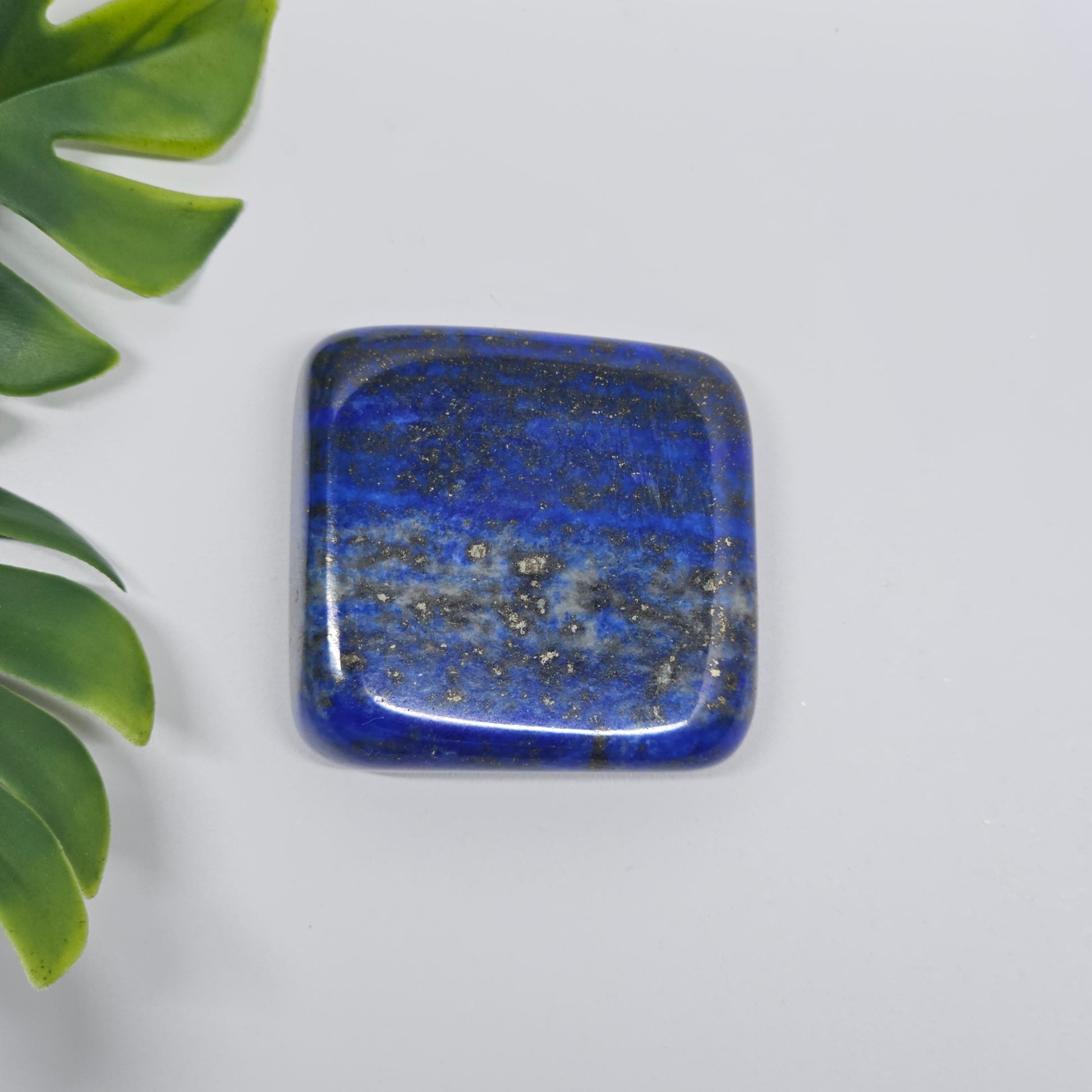 AA Grade Lapis Lazuli polished tumble stone with deep royal blue colour and natural Pyrite speckles. Premium quality crystal available in Australia.