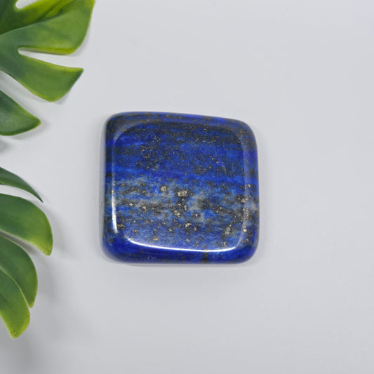 AA Grade Lapis Lazuli polished tumble stone with deep royal blue colour and natural Pyrite speckles. Premium quality crystal available in Australia.