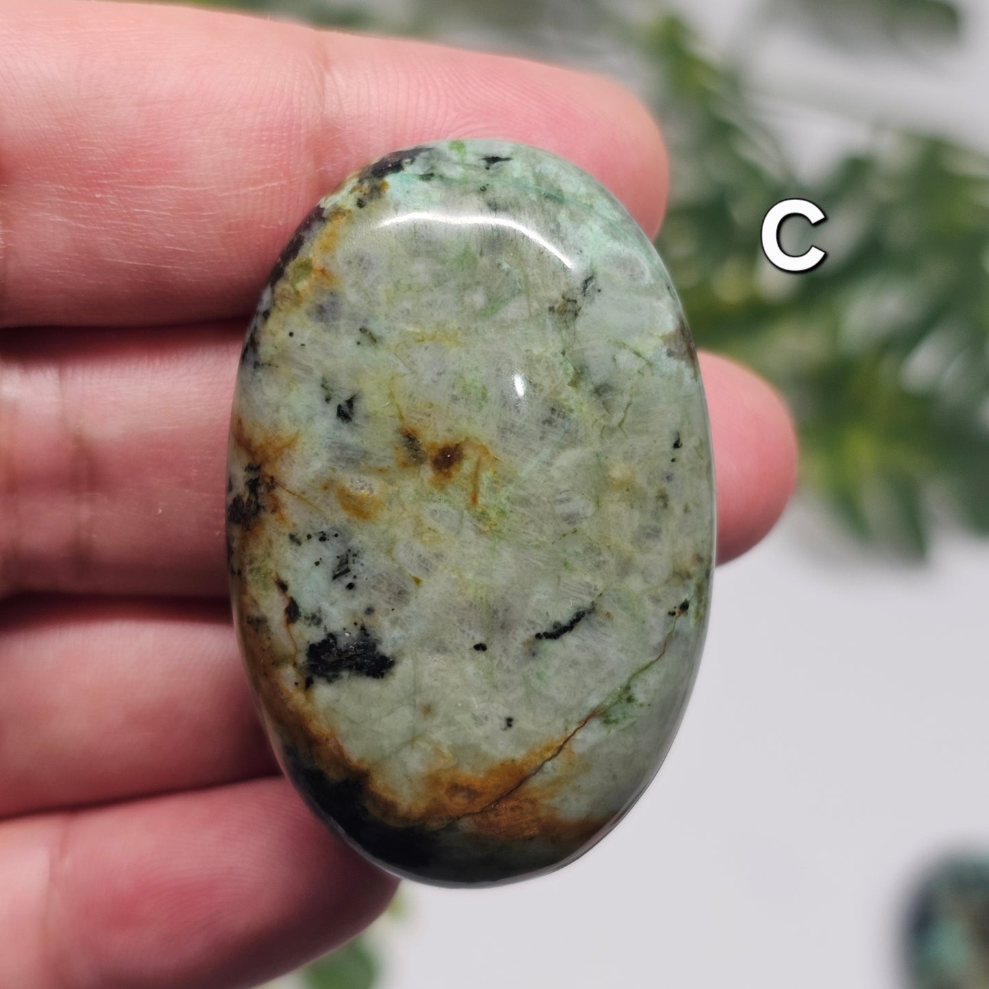 Reverse side of African Turquoise Palm Stone C, highlighting its unique natural markings and earthy colour variations.
