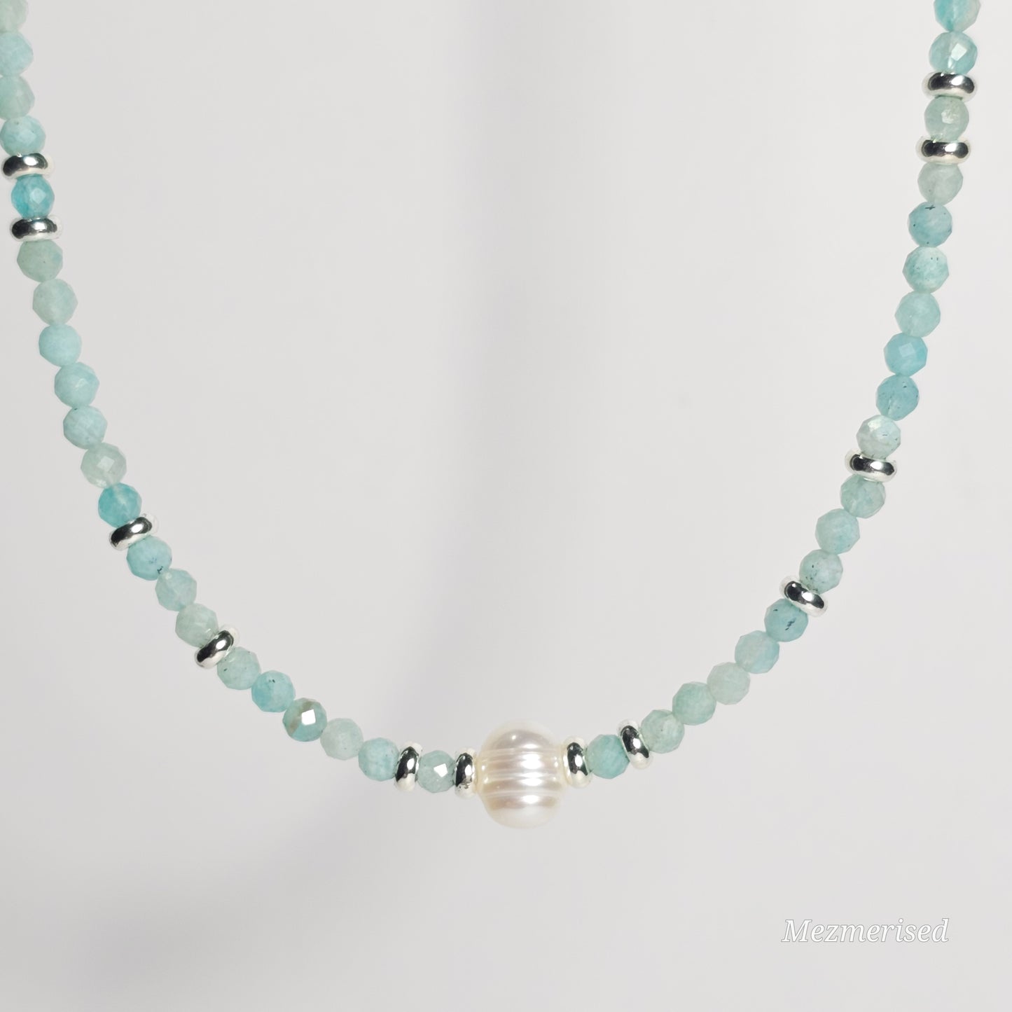 Front view of Amazonite and pearl necklace hanging.