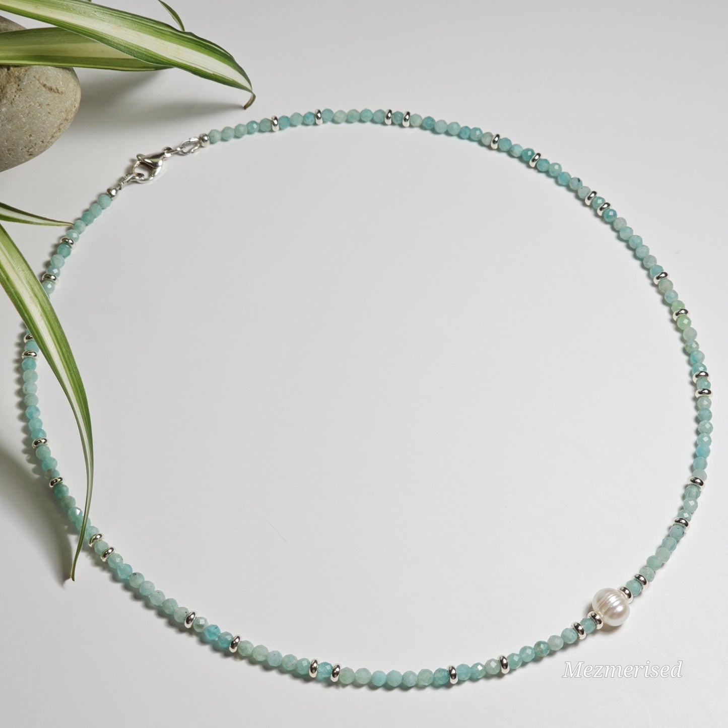 Full view of Amazonite and freshwater pearl necklace laid in a circle.