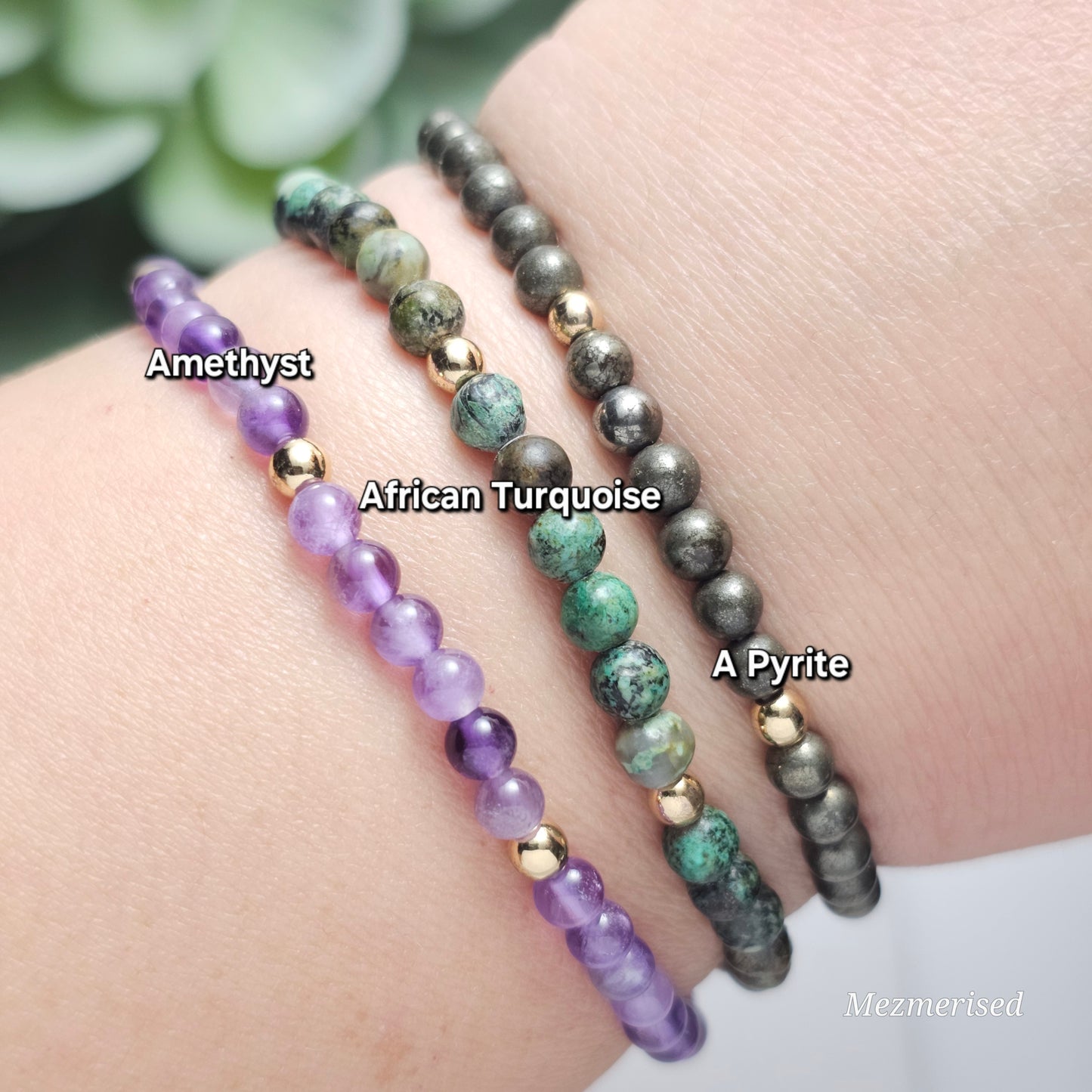 Stacked 4mm Amethyst, African Turquoise and A Grade Pyrite gemstone bracelets with minimalist gold accent details.