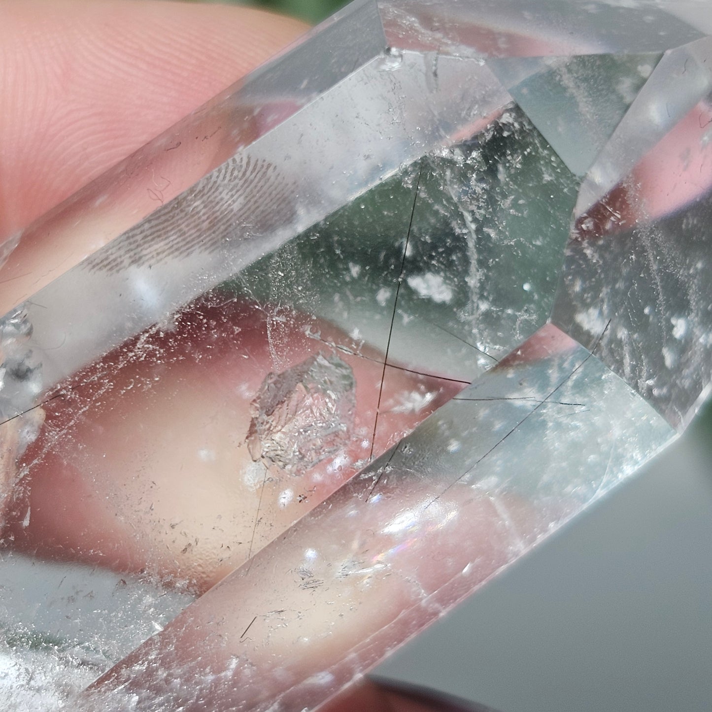 Detailed close-up of Black Rutile Quartz highlighting the delicate rutile inclusions and unique key feature inside the clear quartz.