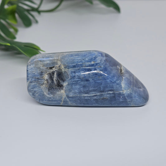 Blue Kyanite Option C shown laid flat, highlighting deep blue tones, and polished freeform shape