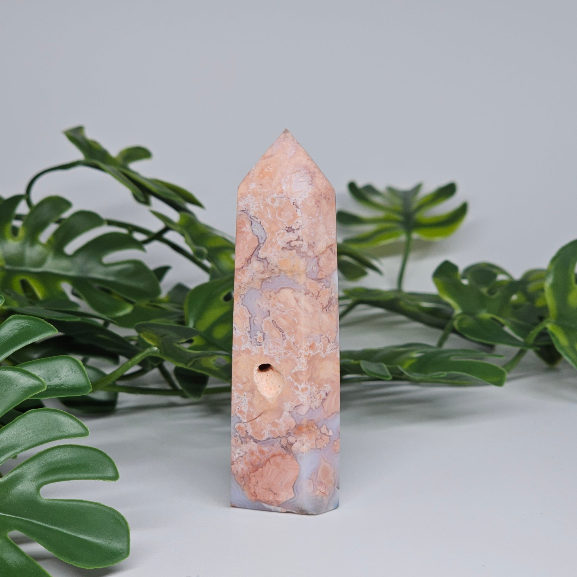 Peachy Pink hued Agate tower with a natural cavity vug