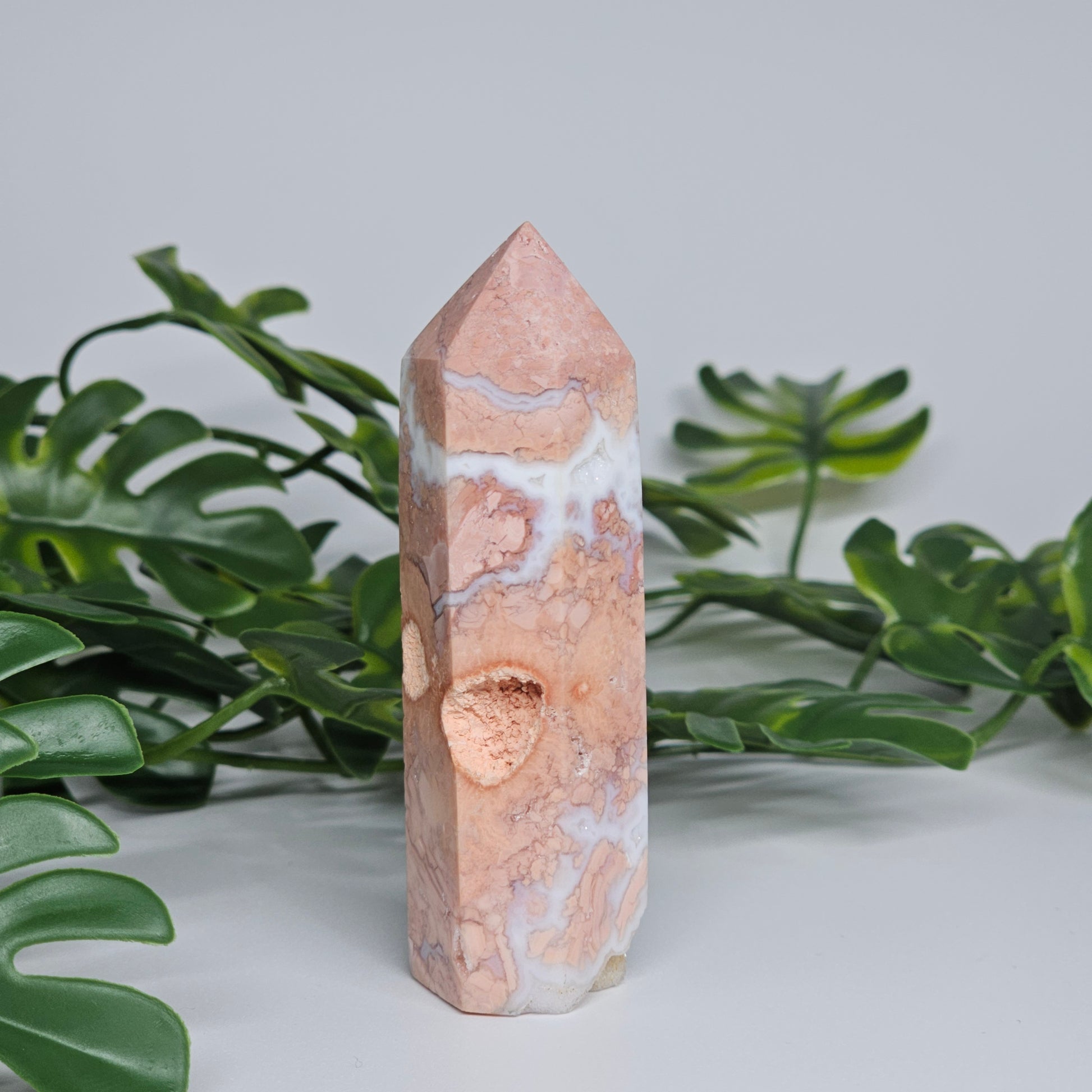 Peachy Pink hued Agate tower with a natural cavity vug