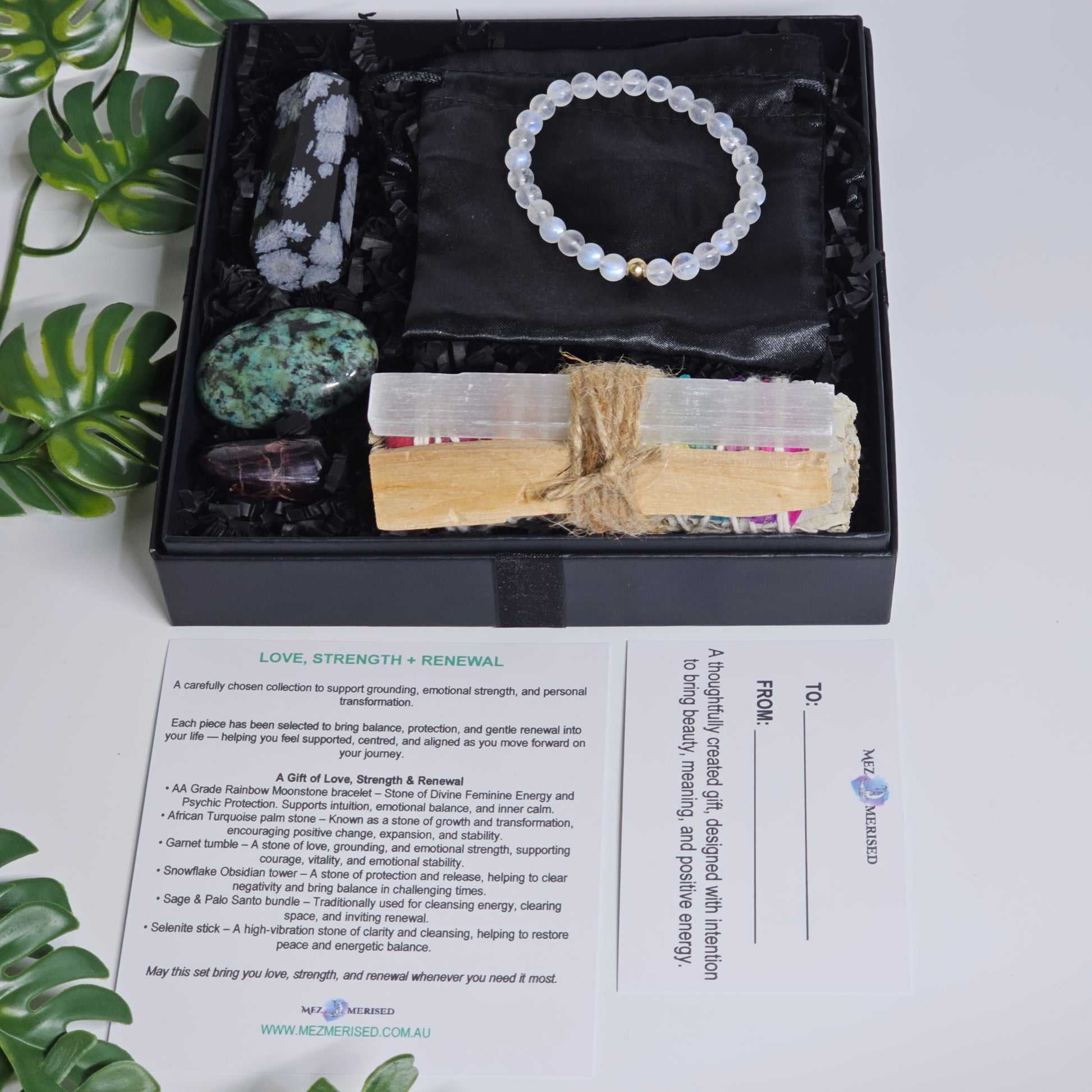 Open crystal gift box showing all items neatly arranged inside.