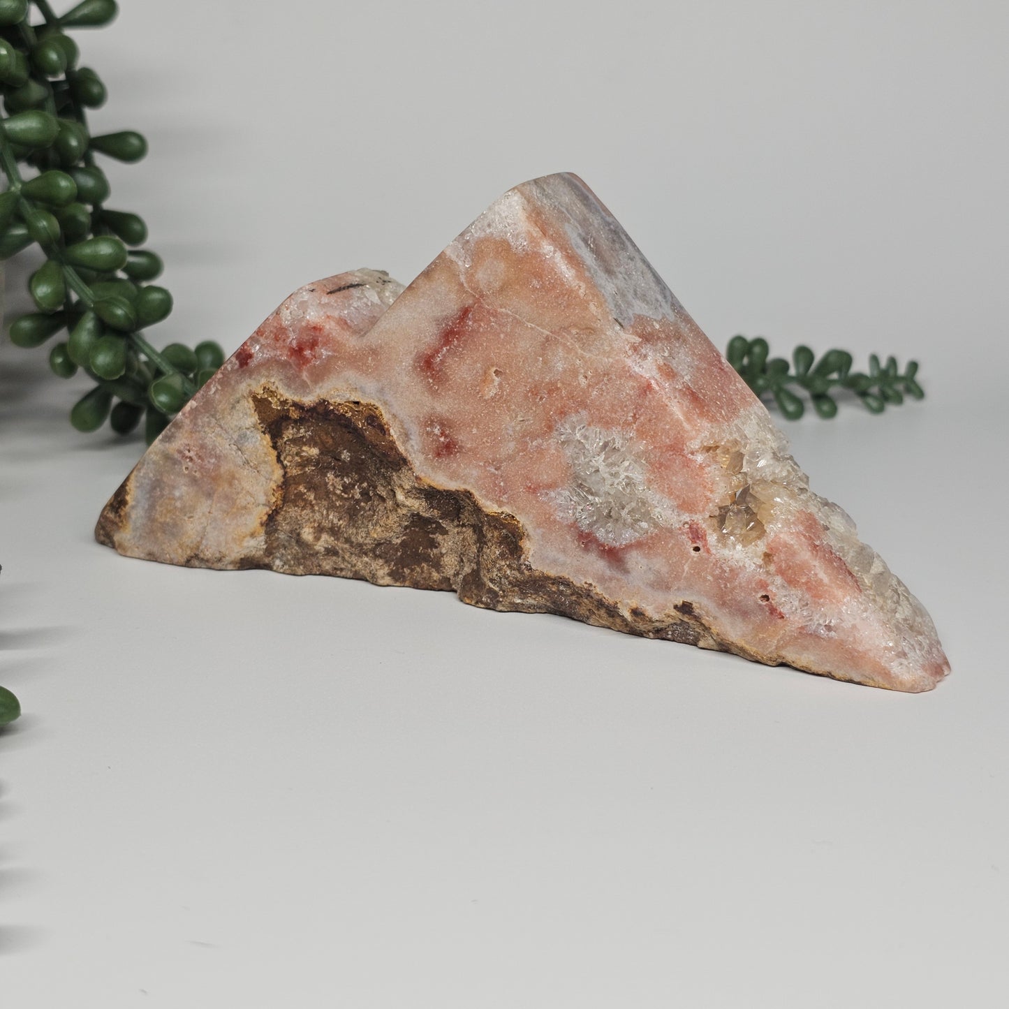 The reverse side of the specimen showcasing the natural, unpolished raw form in its earthy, organic state.
