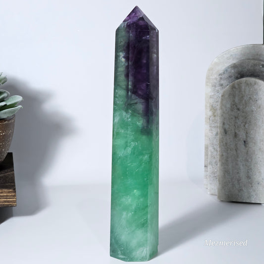 Fluorite tower standing showing green and purple tones.