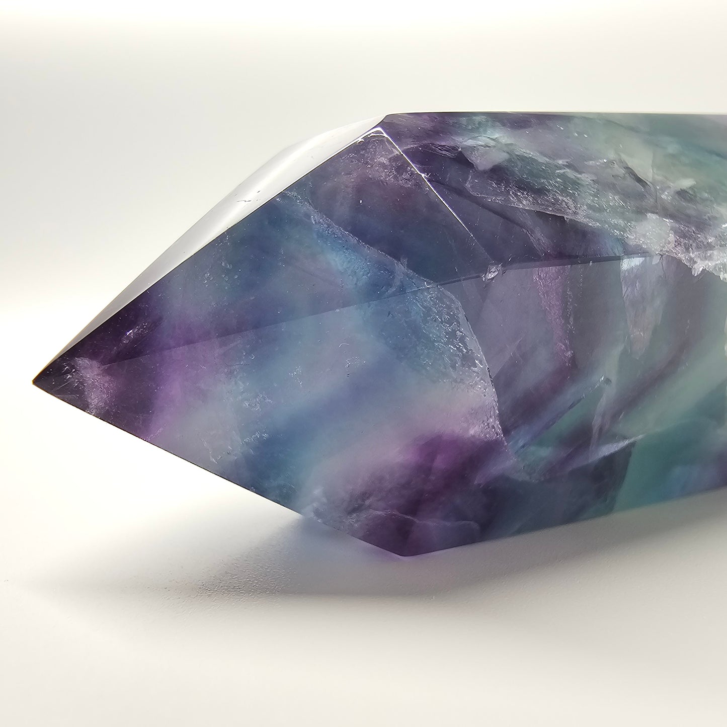 Fluorite crystal tower point with colourful banded marks