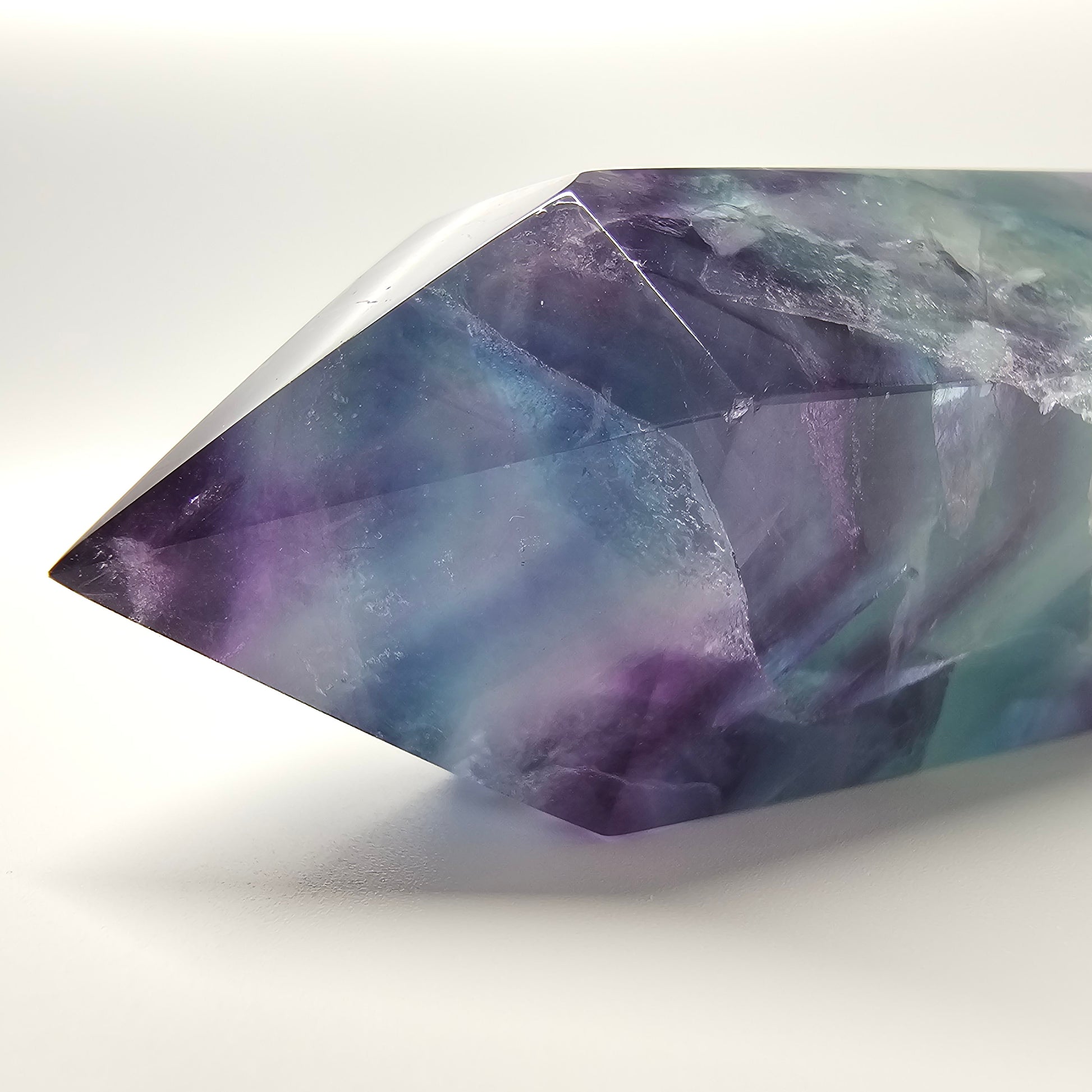 Fluorite crystal tower point with colourful banded marks