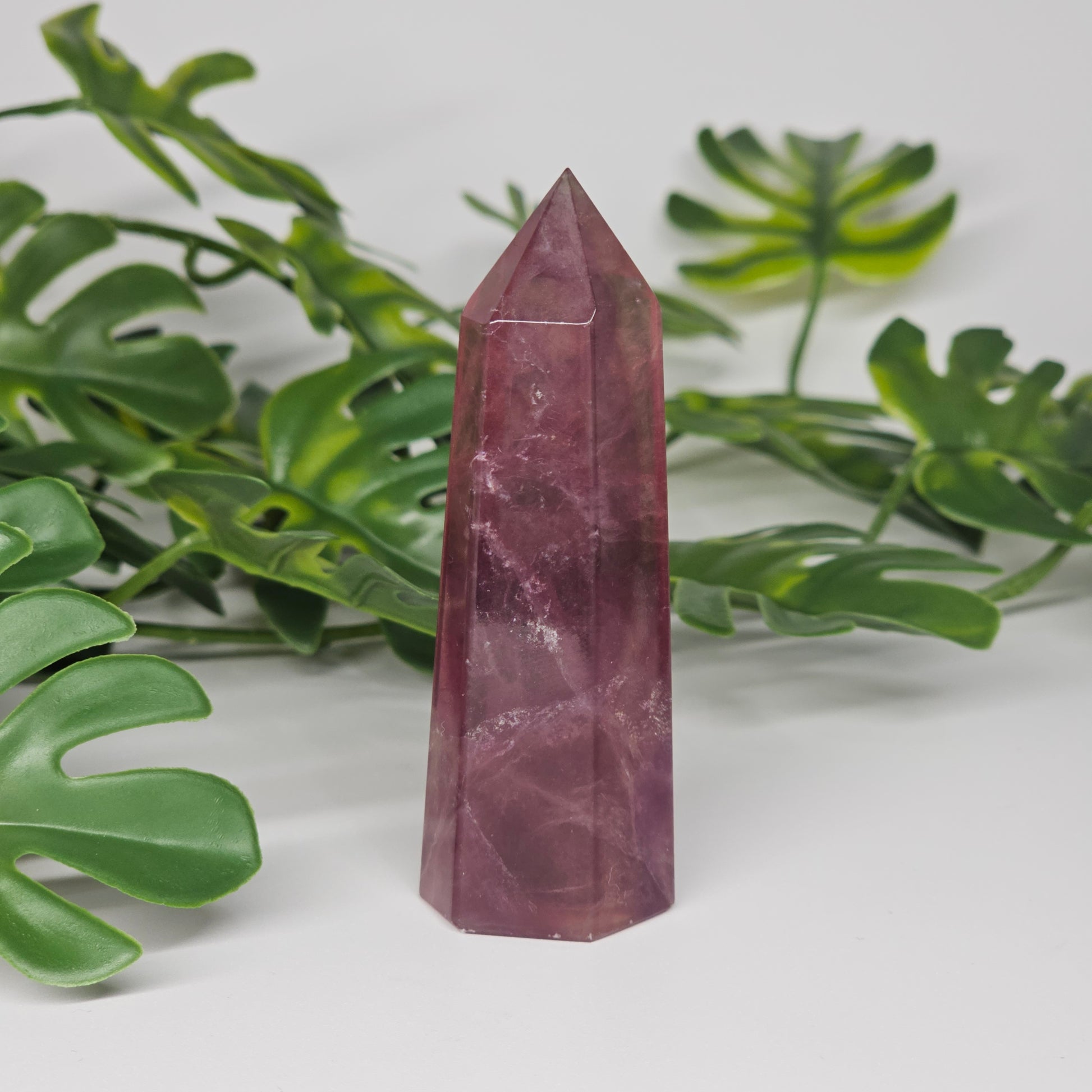 Fluorite crystal tower side profile showing purple and yellow tones and polished finish