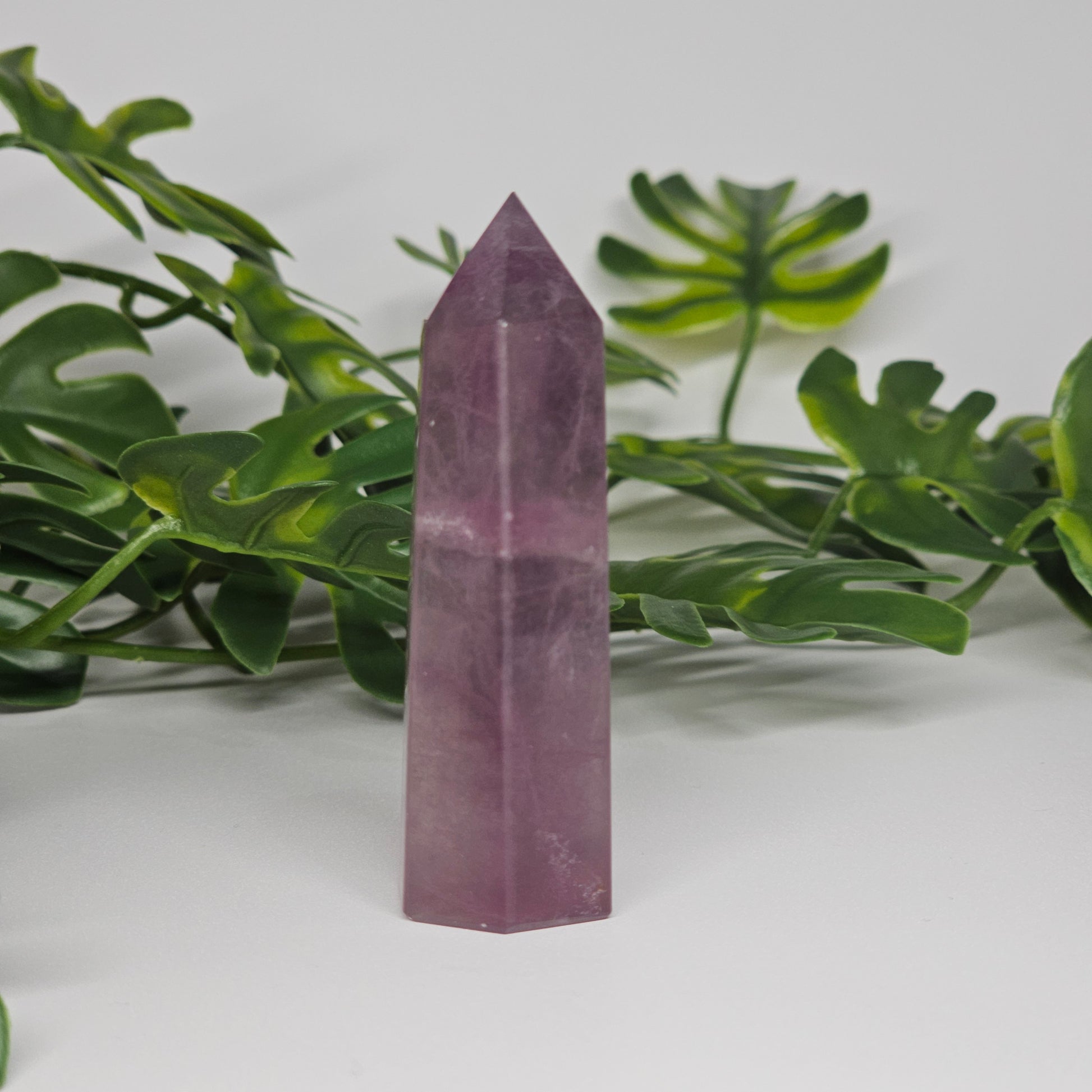 Fluorite crystal tower side view displaying veining and translucent natural formation