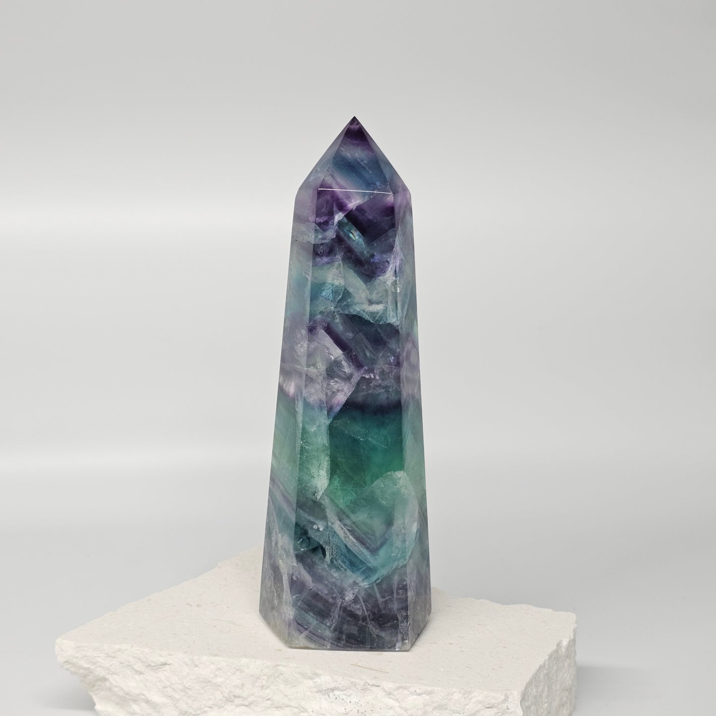 Fluorite crystal tower showing natural colour layers and polished finish