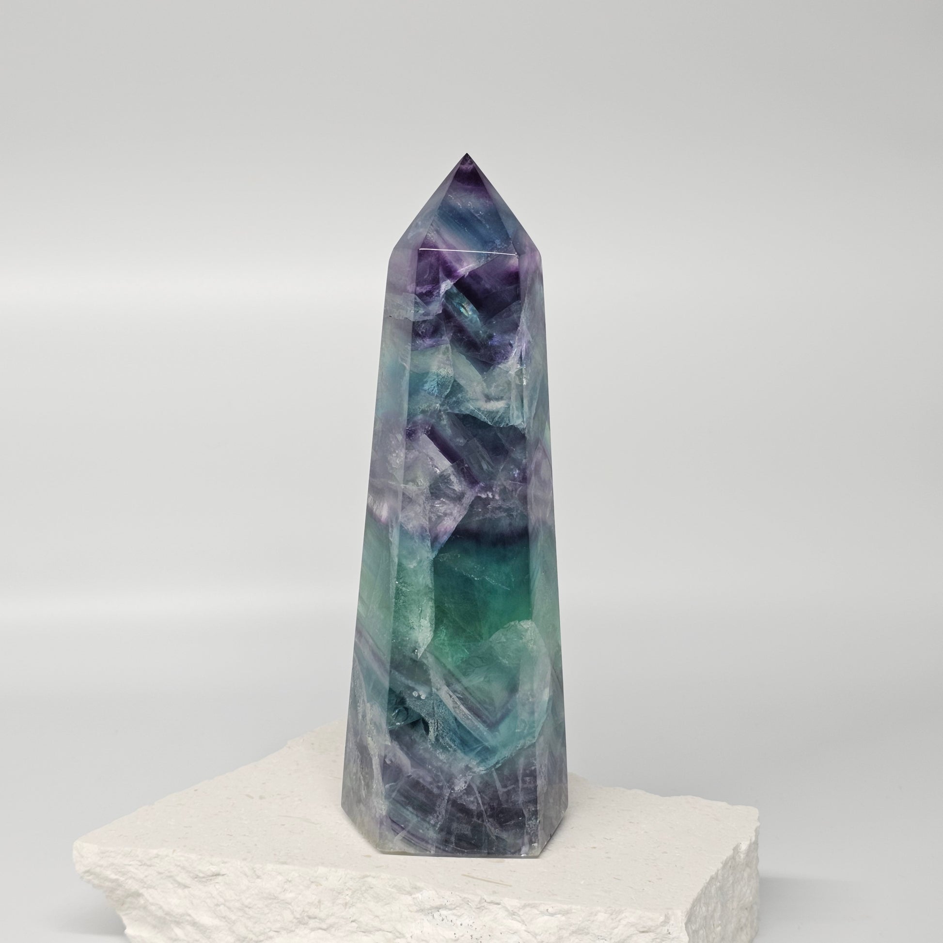Fluorite crystal tower showing natural colour layers and polished finish