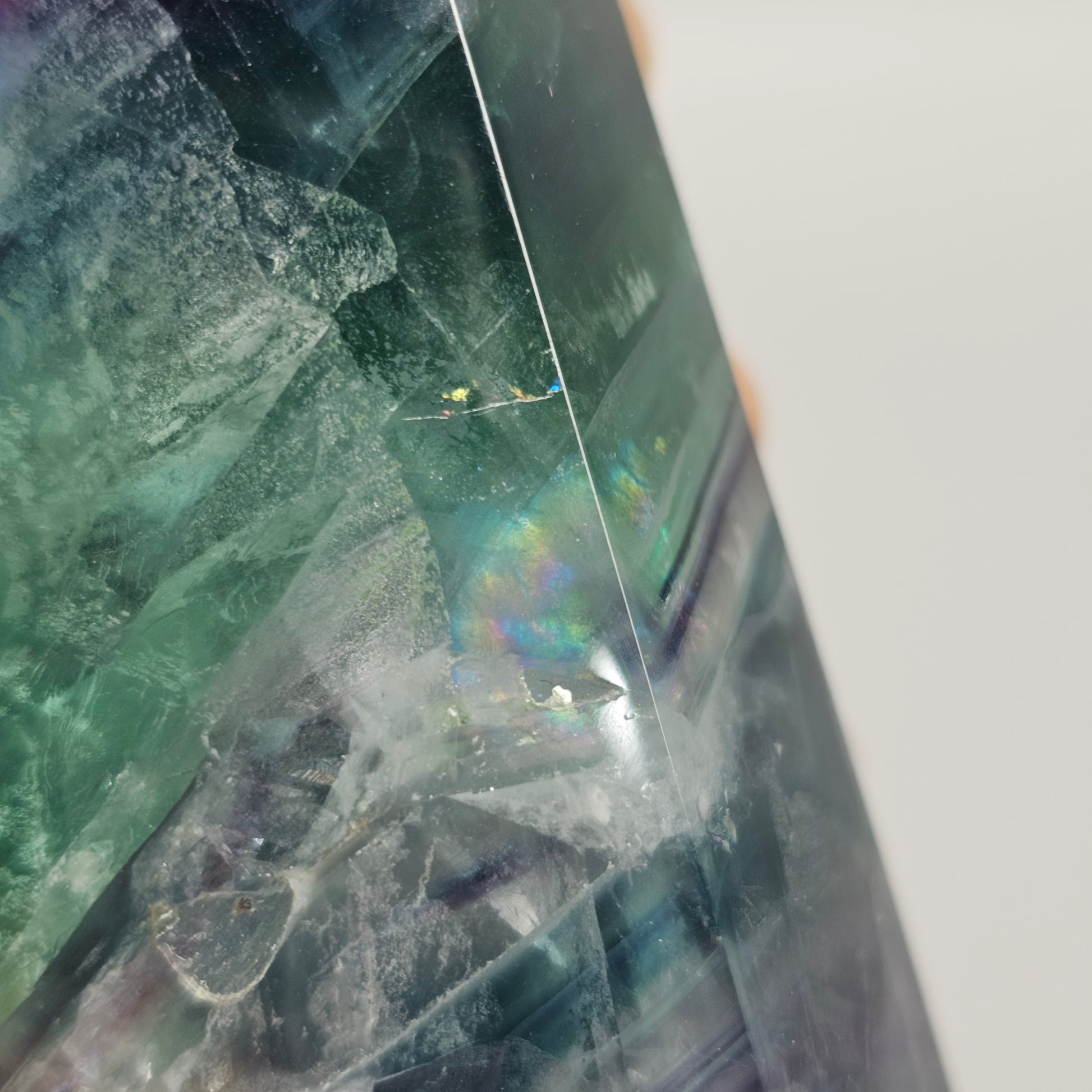 Close up of Fluorite crystal tower with colourful banding and rainbows