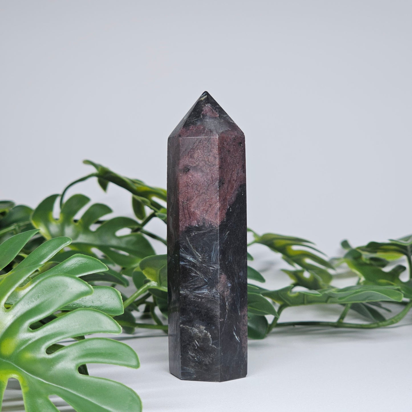 Garnet and Arfvedsonite crystal tower with deep red and black natural mineral formation