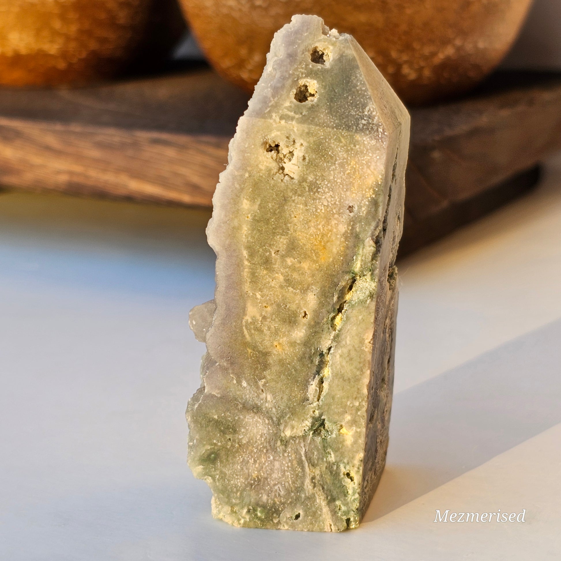 Side view of Grape Agate obelisk highlighting natural purple tones, layered structure, and organic formation details.