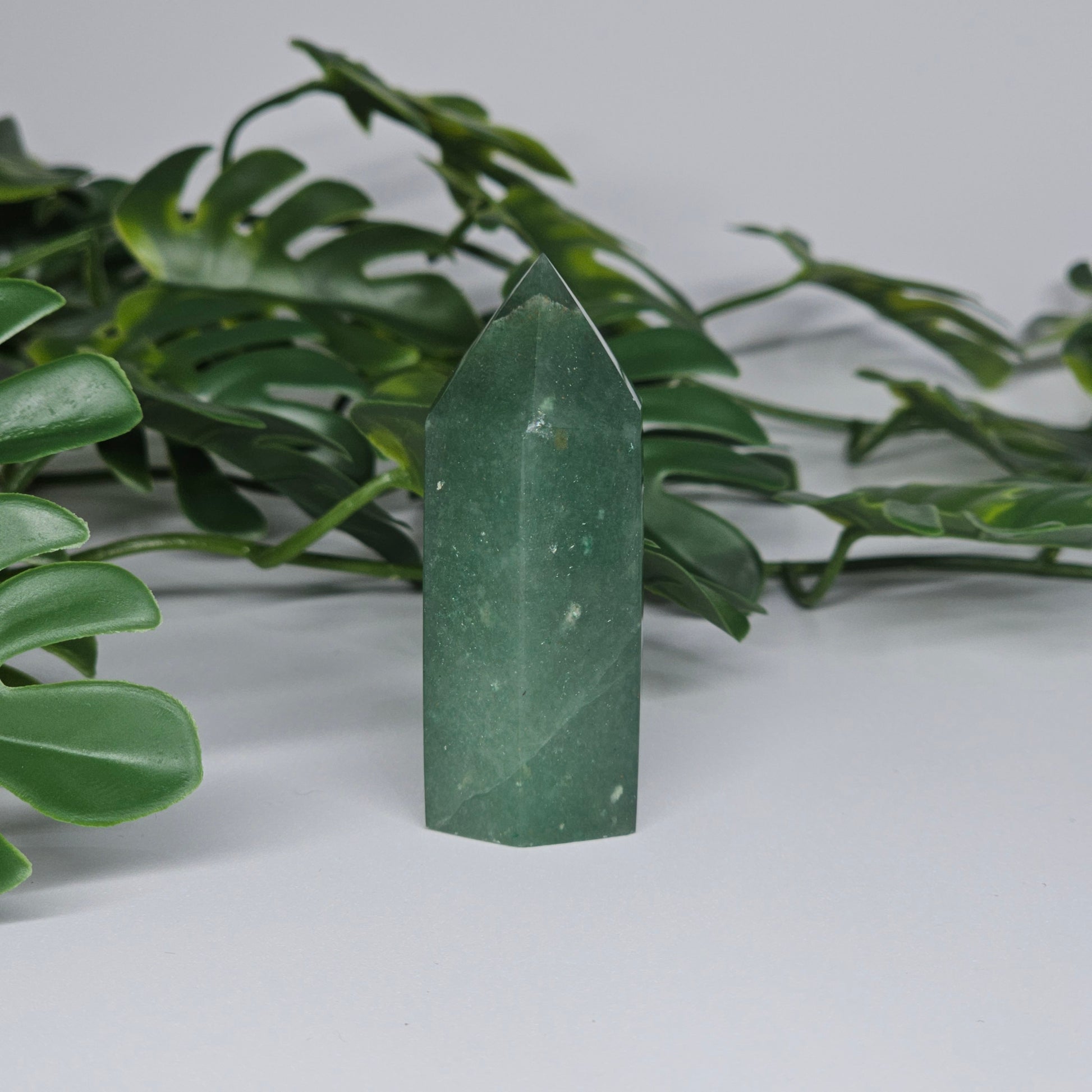 Green aventurine healing crystal tower with soft green colour and polished point