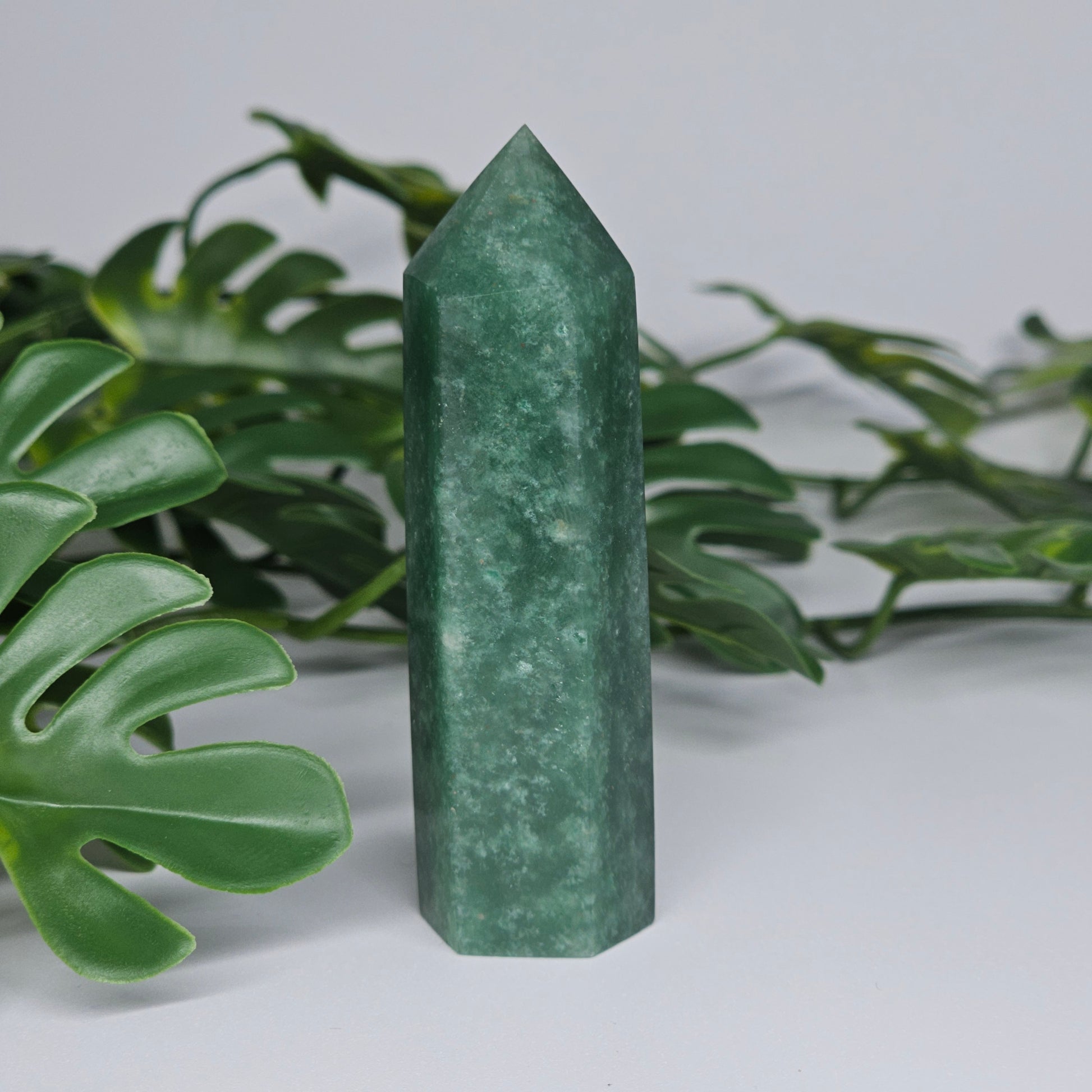 Green aventurine healing crystal tower with soft green colour and polished point