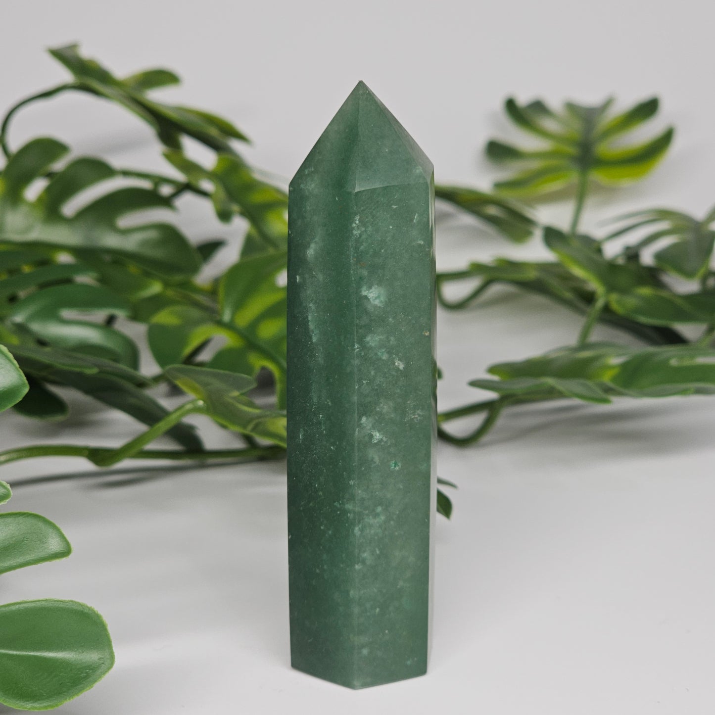 Green aventurine healing crystal tower with soft green colour and polished point
