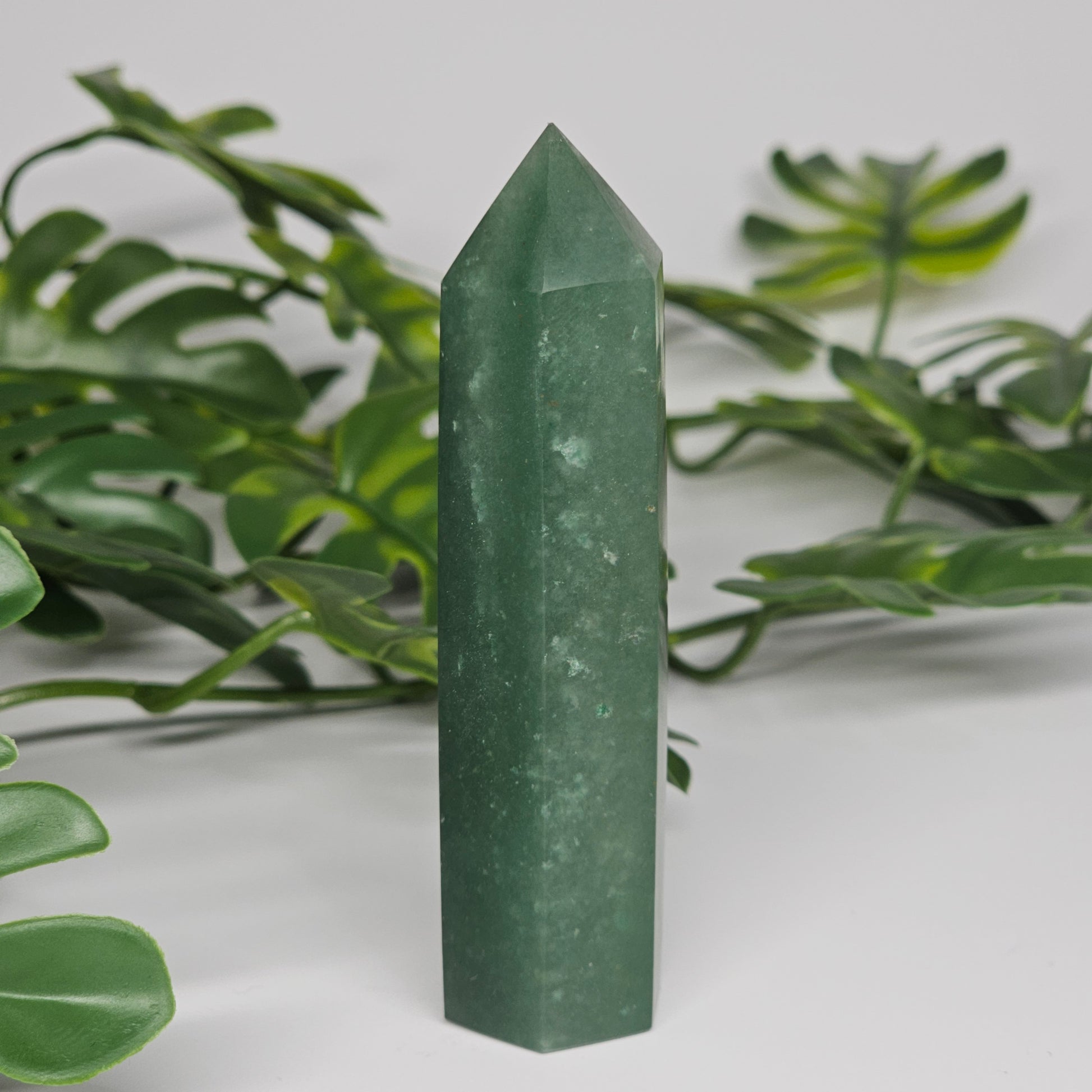 Green aventurine healing crystal tower with soft green colour and polished point