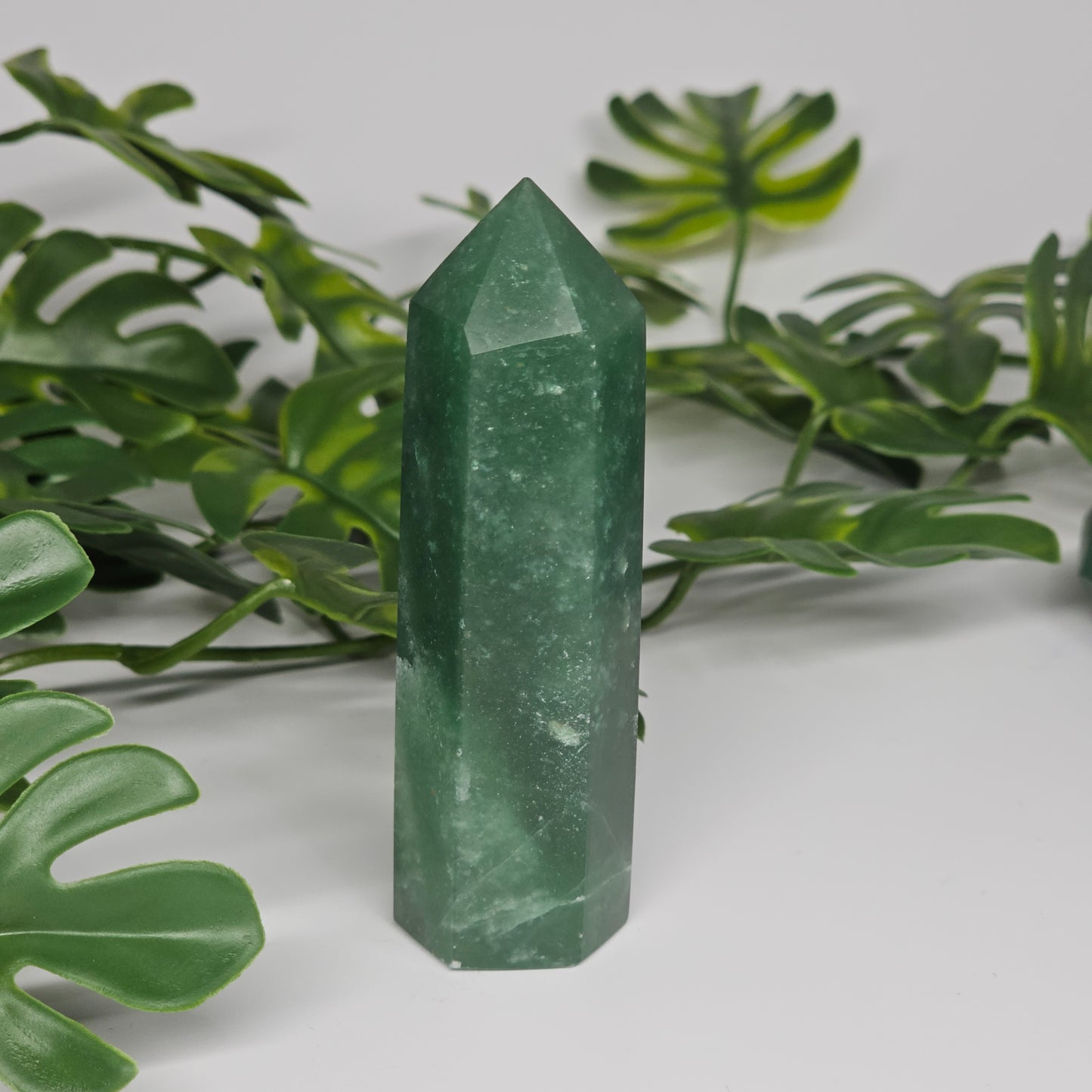 Green aventurine healing crystal tower with soft green colour and polished point