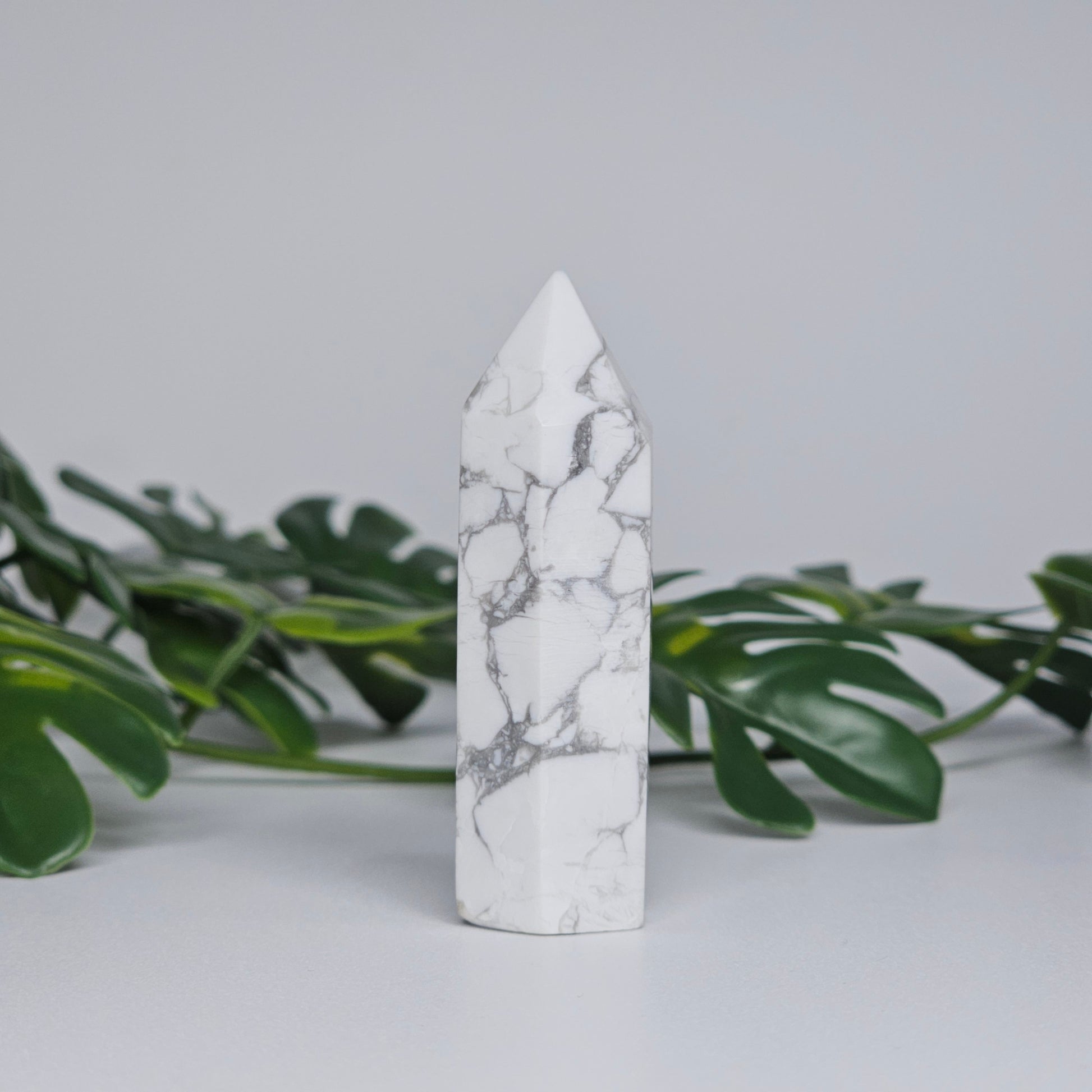 Side view of Howlite tower showing smooth polished finish.