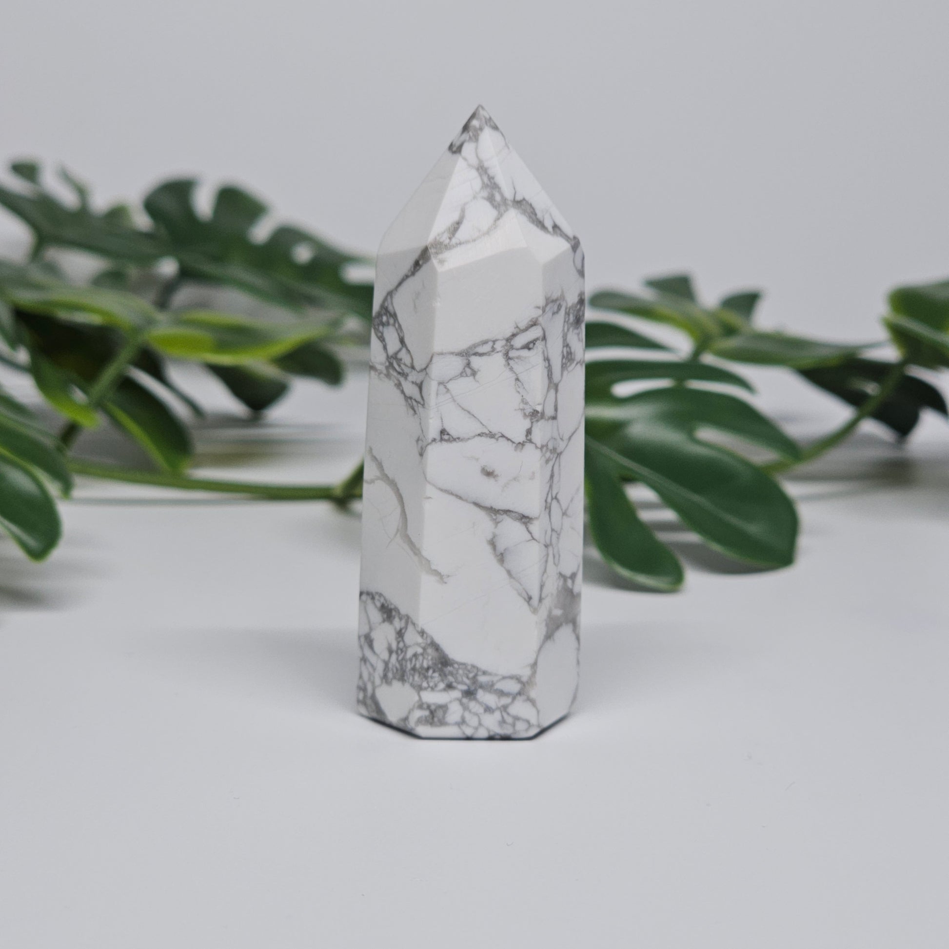 Side view of Howlite tower showing smooth polished finish.