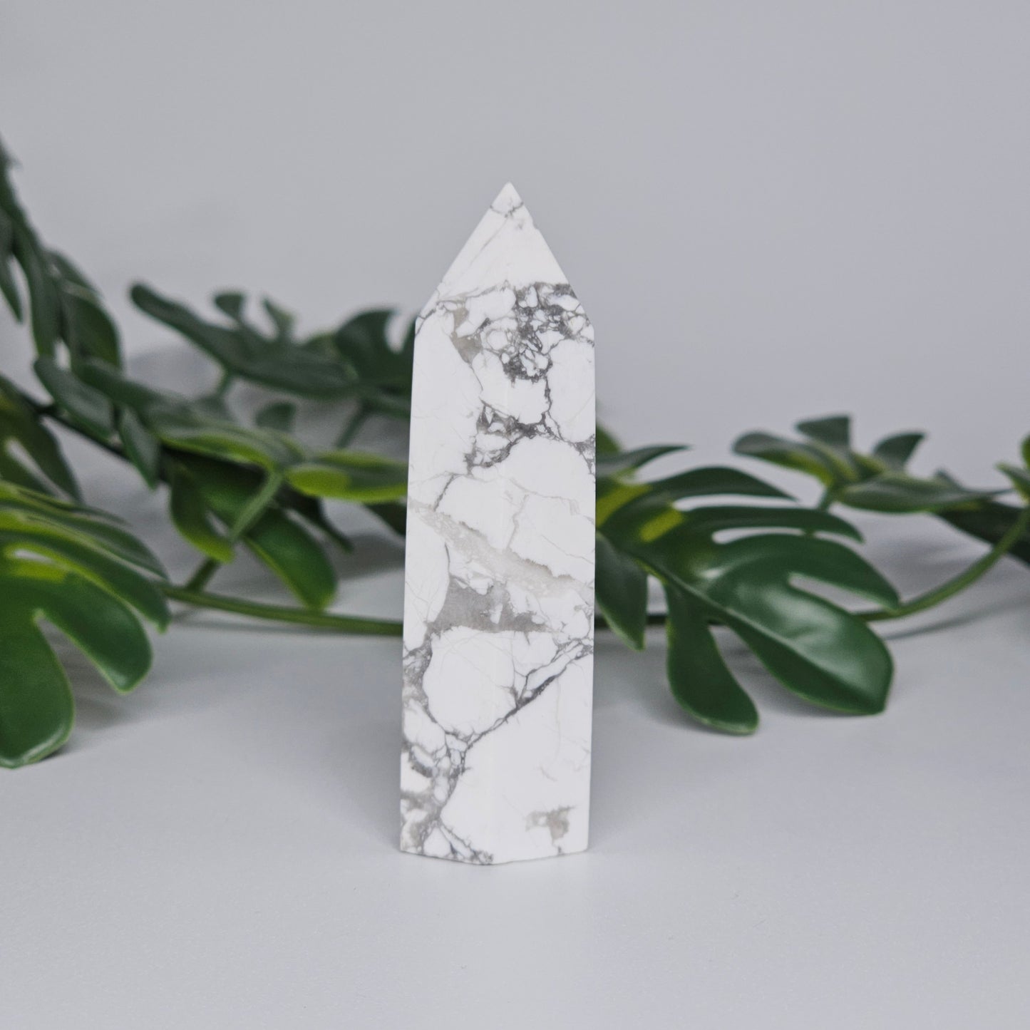 Side view of Howlite tower showing smooth polished finish.