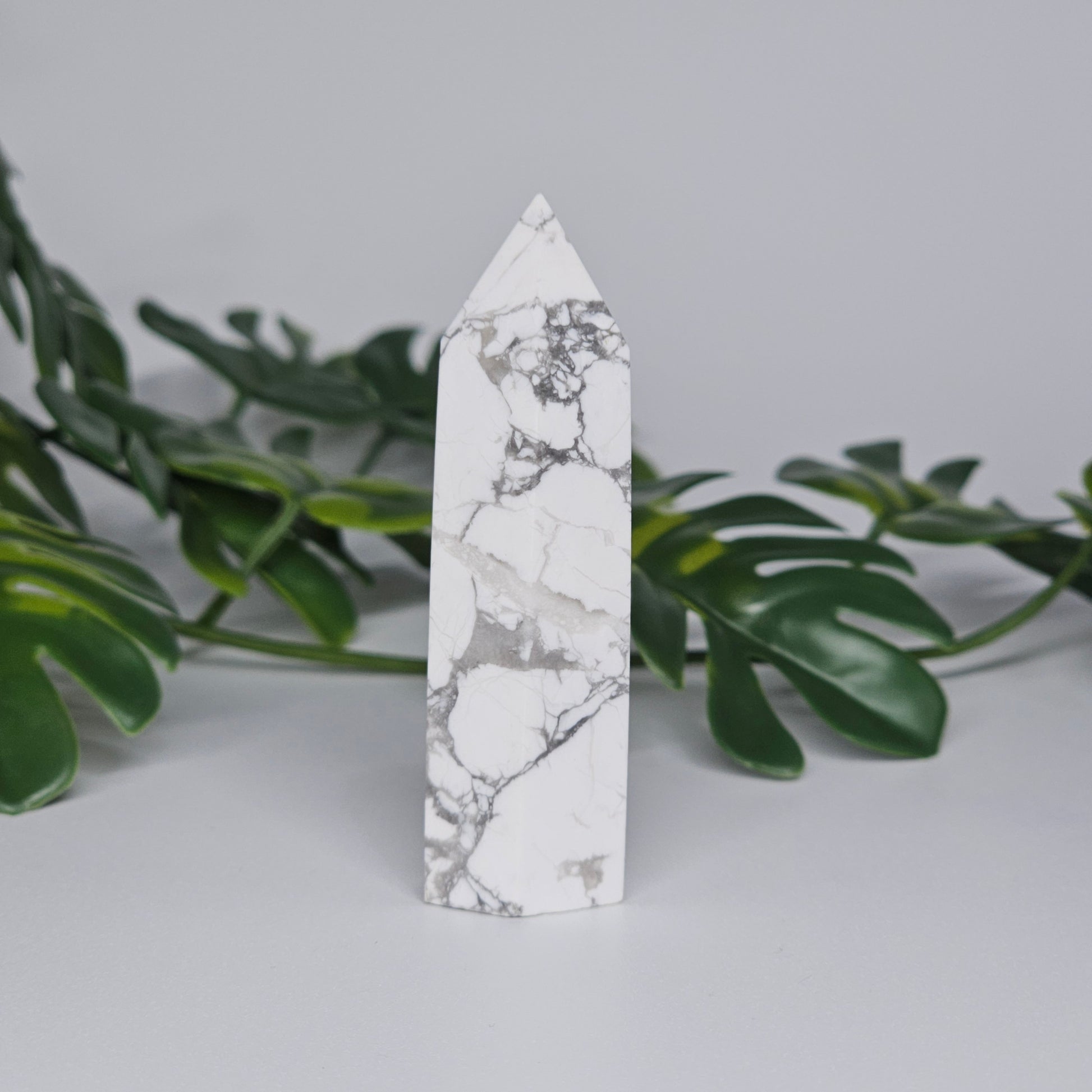 Side view of Howlite tower showing smooth polished finish.