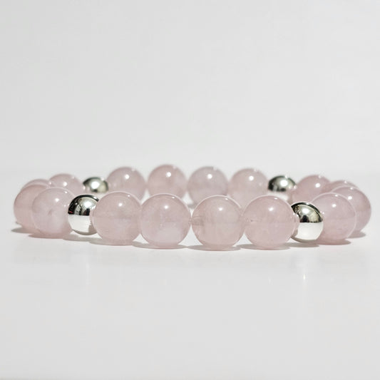 Natural AA Grade Madagascan Rose Quartz bracelet accented with manufactured silver plated Hematite beads.
