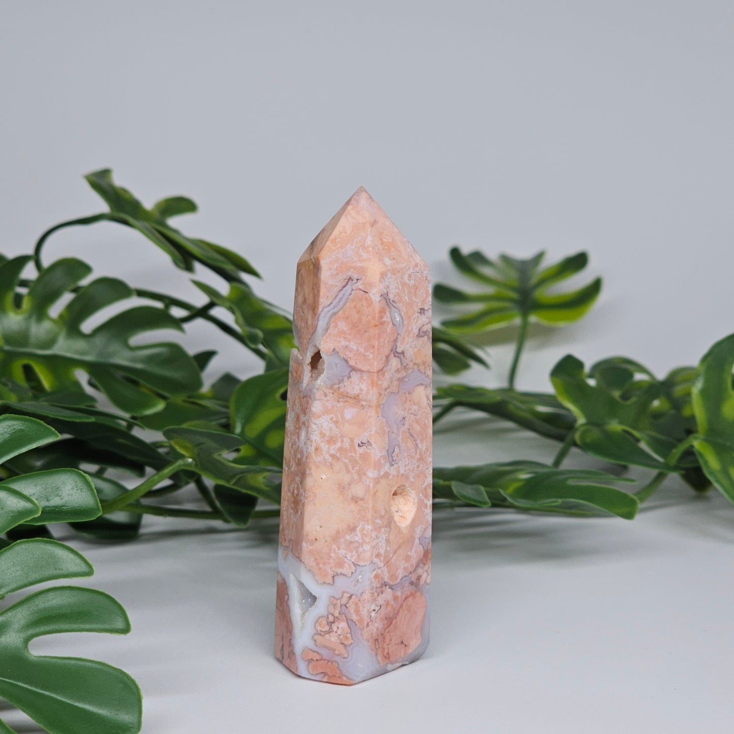 Cotton candy agate tower crystal showing layered pastel colours and polished point
