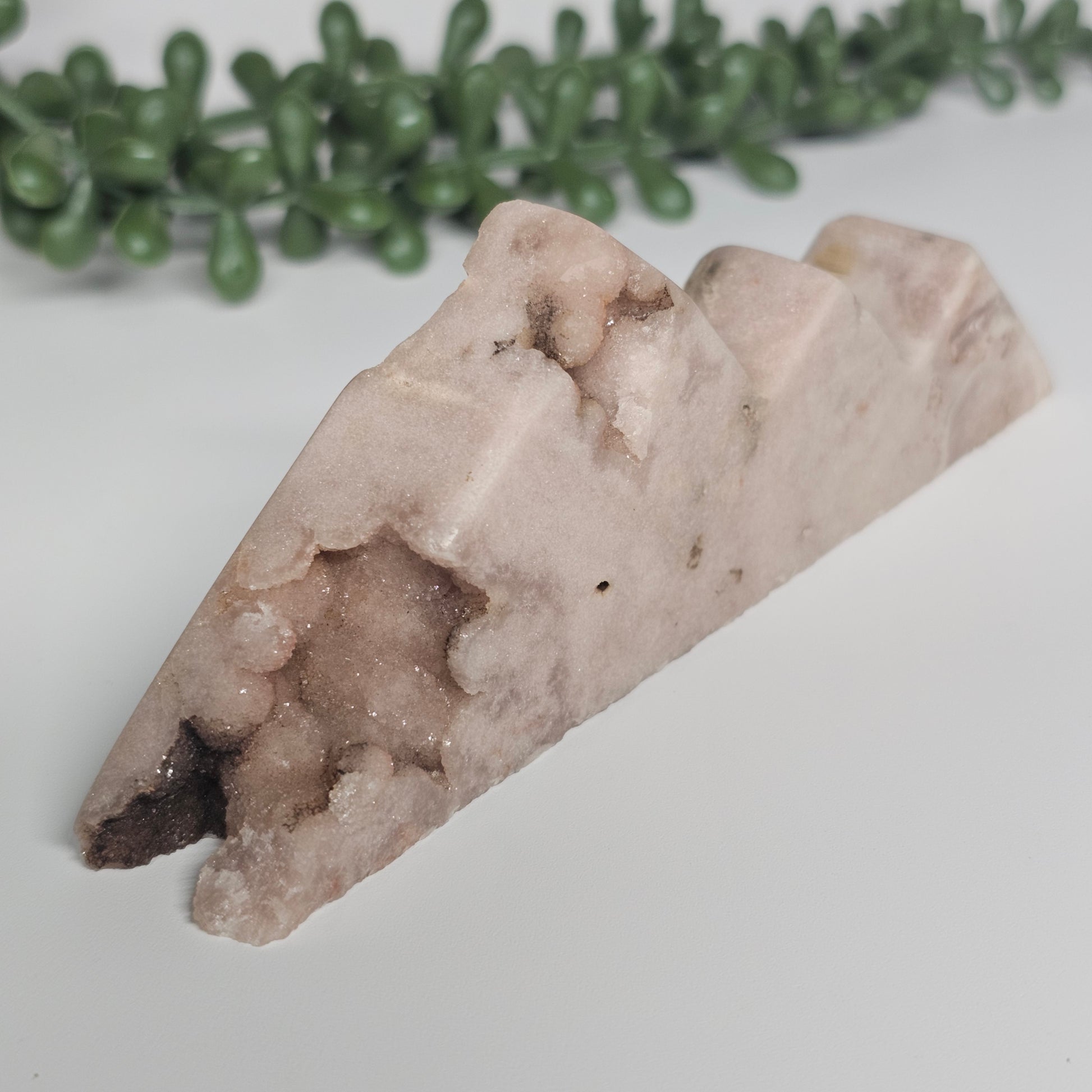 A detailed view of the polished front face, showing the botryoidal cluster of natural sugar druzy on the bottom left corner.