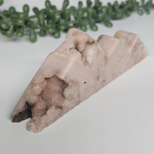 A detailed view of the polished front face, showing the botryoidal cluster of natural sugar druzy on the bottom left corner.