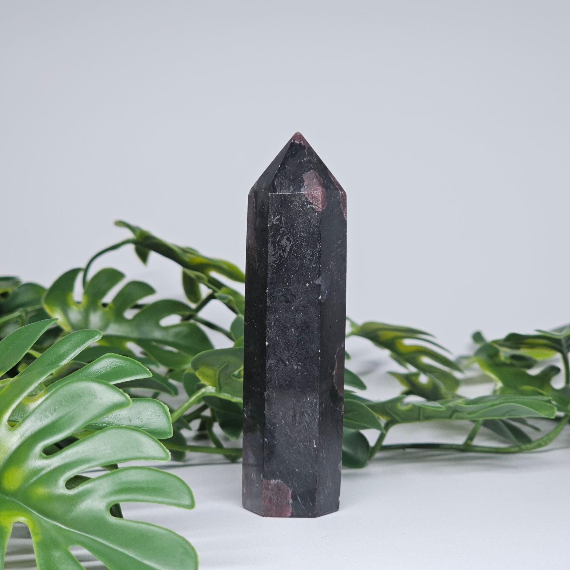 Grounding crystal tower for protection and strength displayed as home decor piece
